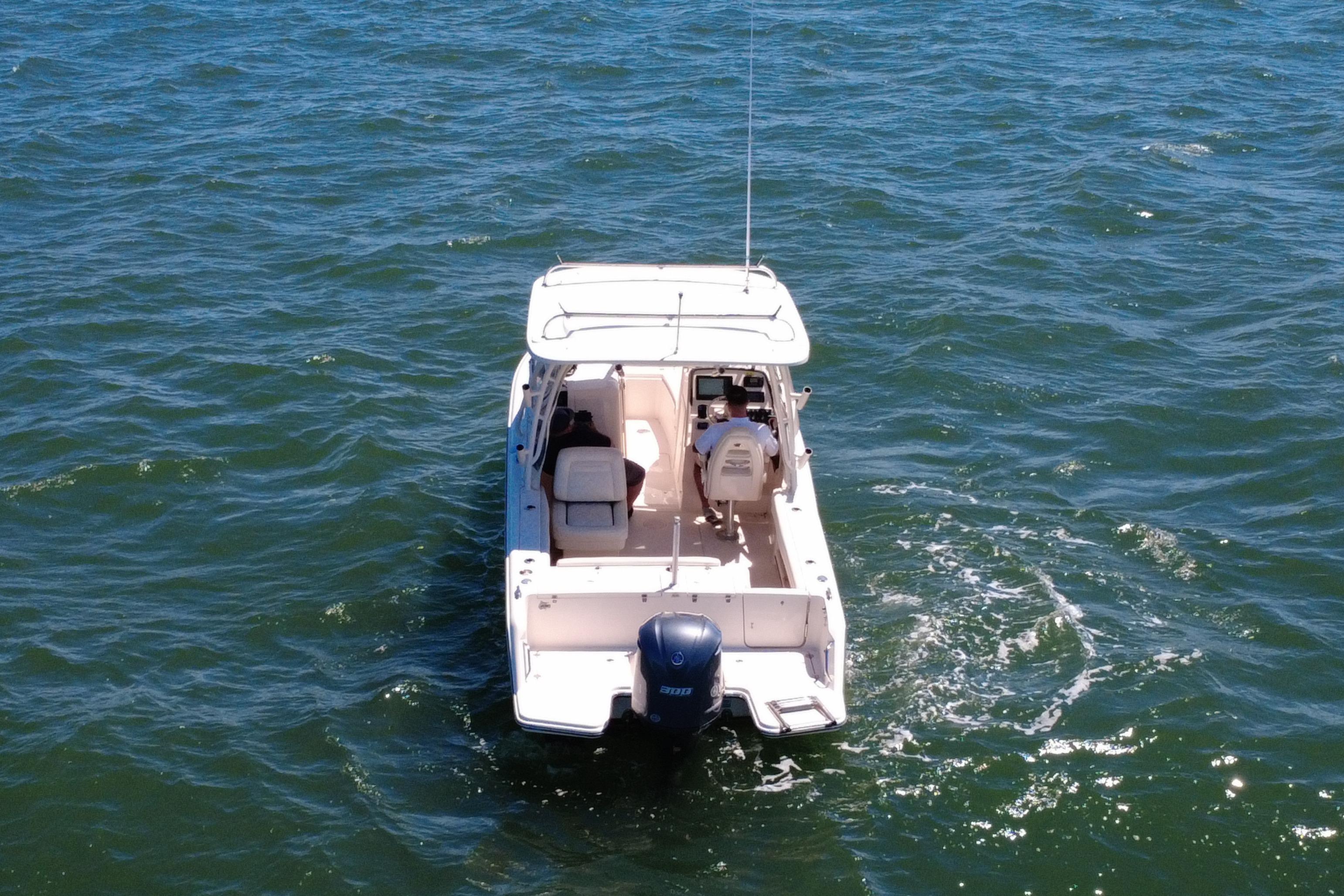 2017 Grady-White Freedom 235 boat cruising on open water.
