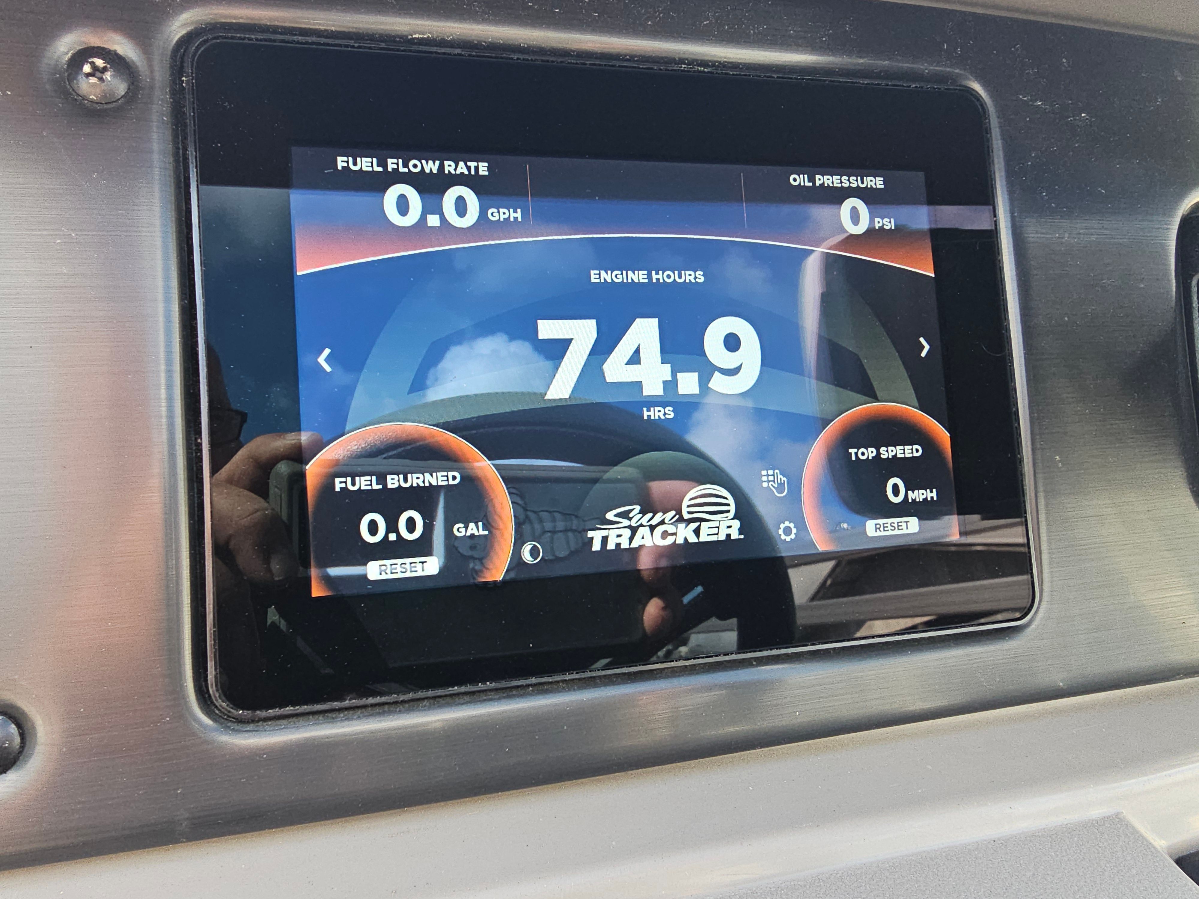 2024 Sun Tracker Fishin' Barge 22 DLX display showing 74.9 engine hours.