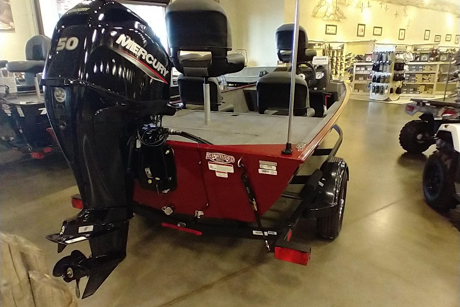 2026 Tracker Bass Tracker Classic XL boat with Mercury 50 engine displayed indoors.