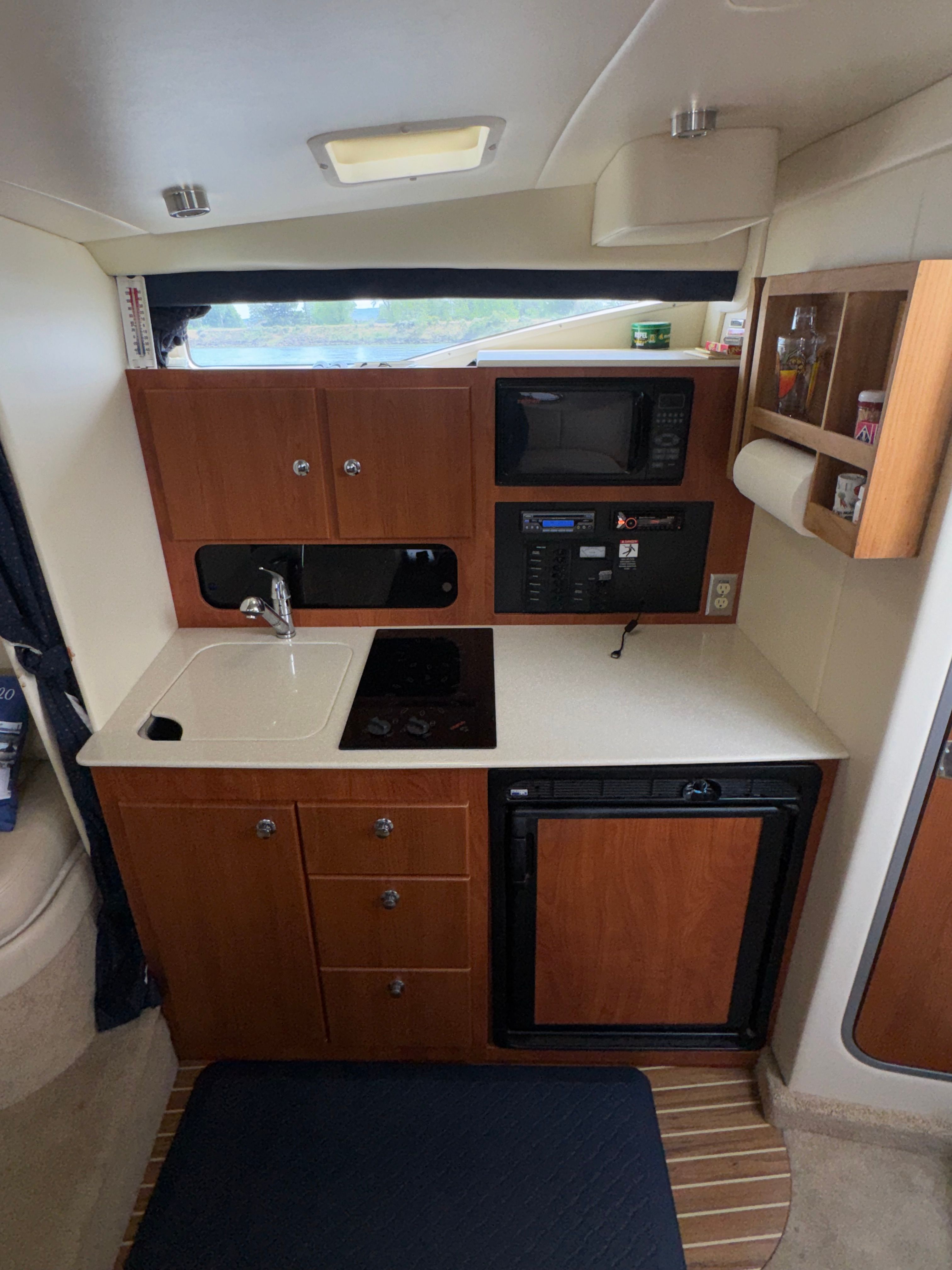 Interior of 2008 Bayliner 340 yacht kitchen area.