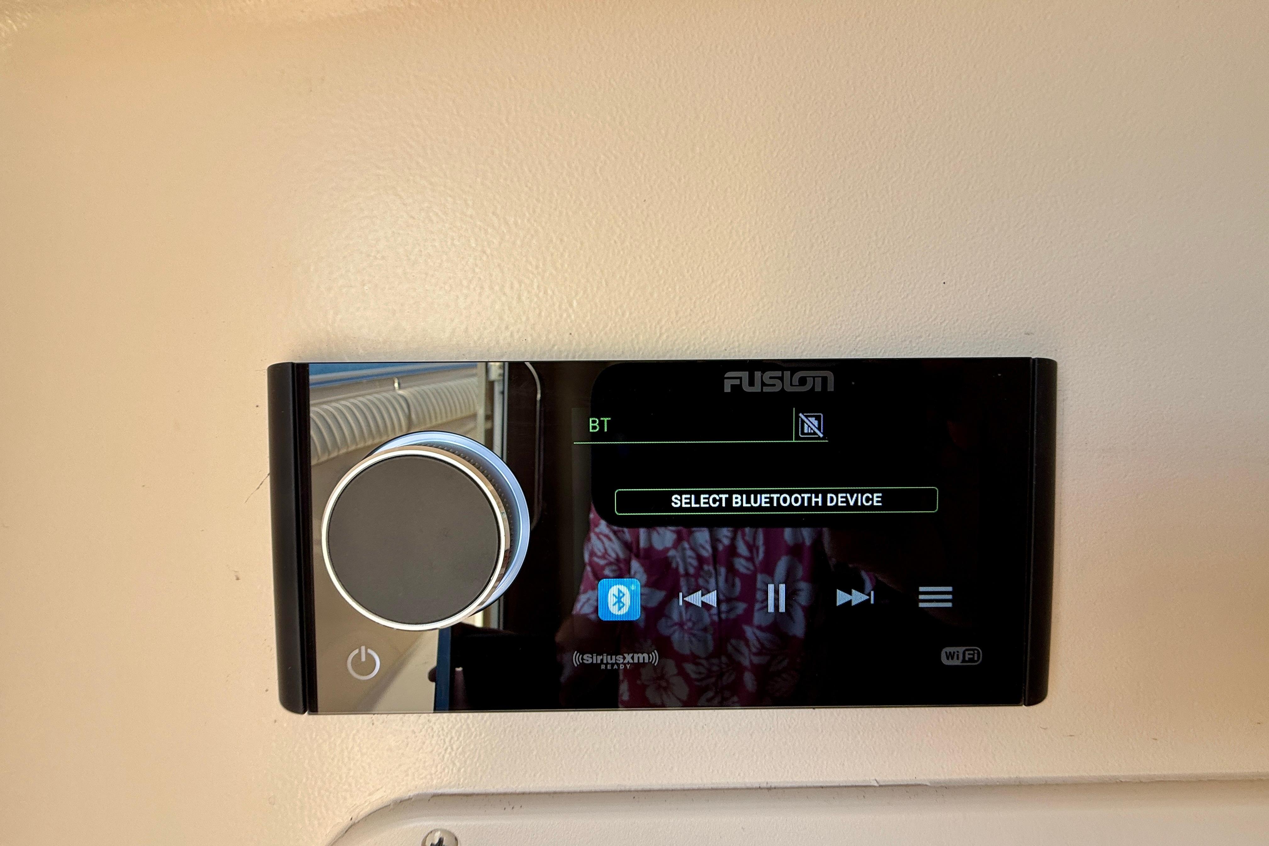 Fusion stereo system on 2012 Grady-White Canyon 336 boat, displaying Bluetooth options.