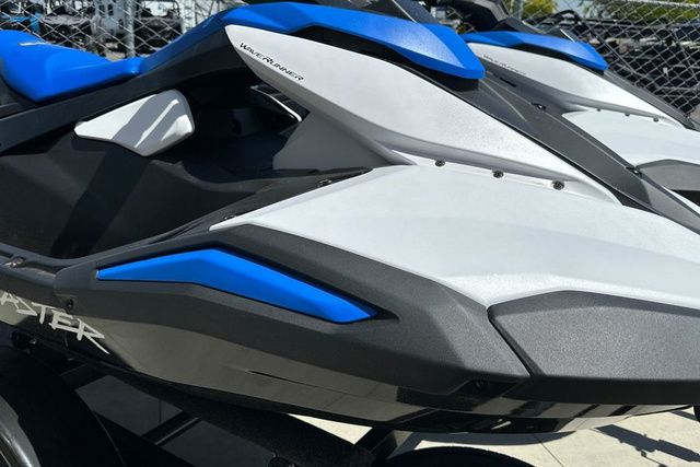 A Yamaha WaveRunner Jetblaster in black and blue, parked on a concrete surface.
