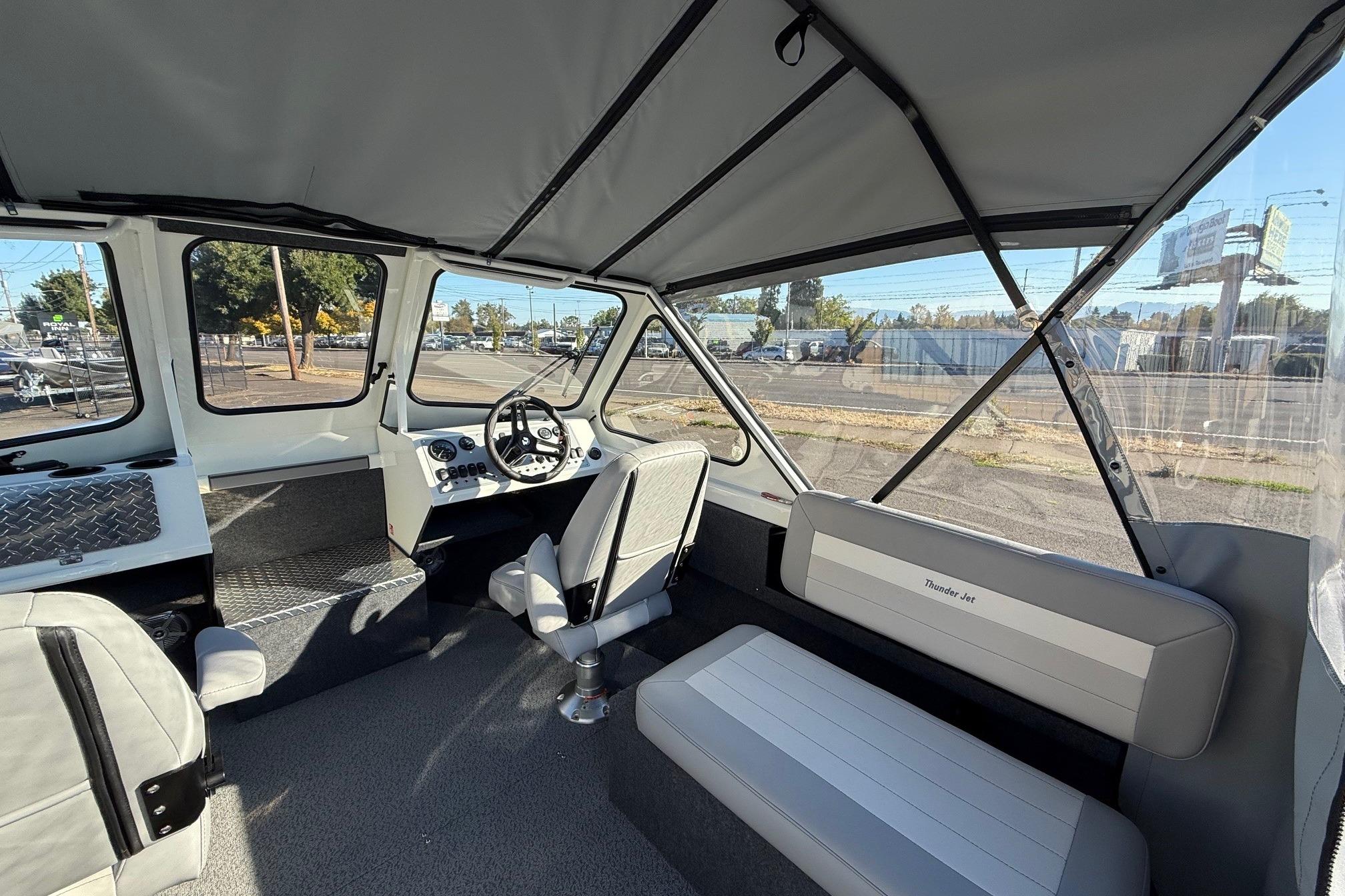 Interior of 2026 Thunder Jet 185 Luxor boat with seating and steering wheel.