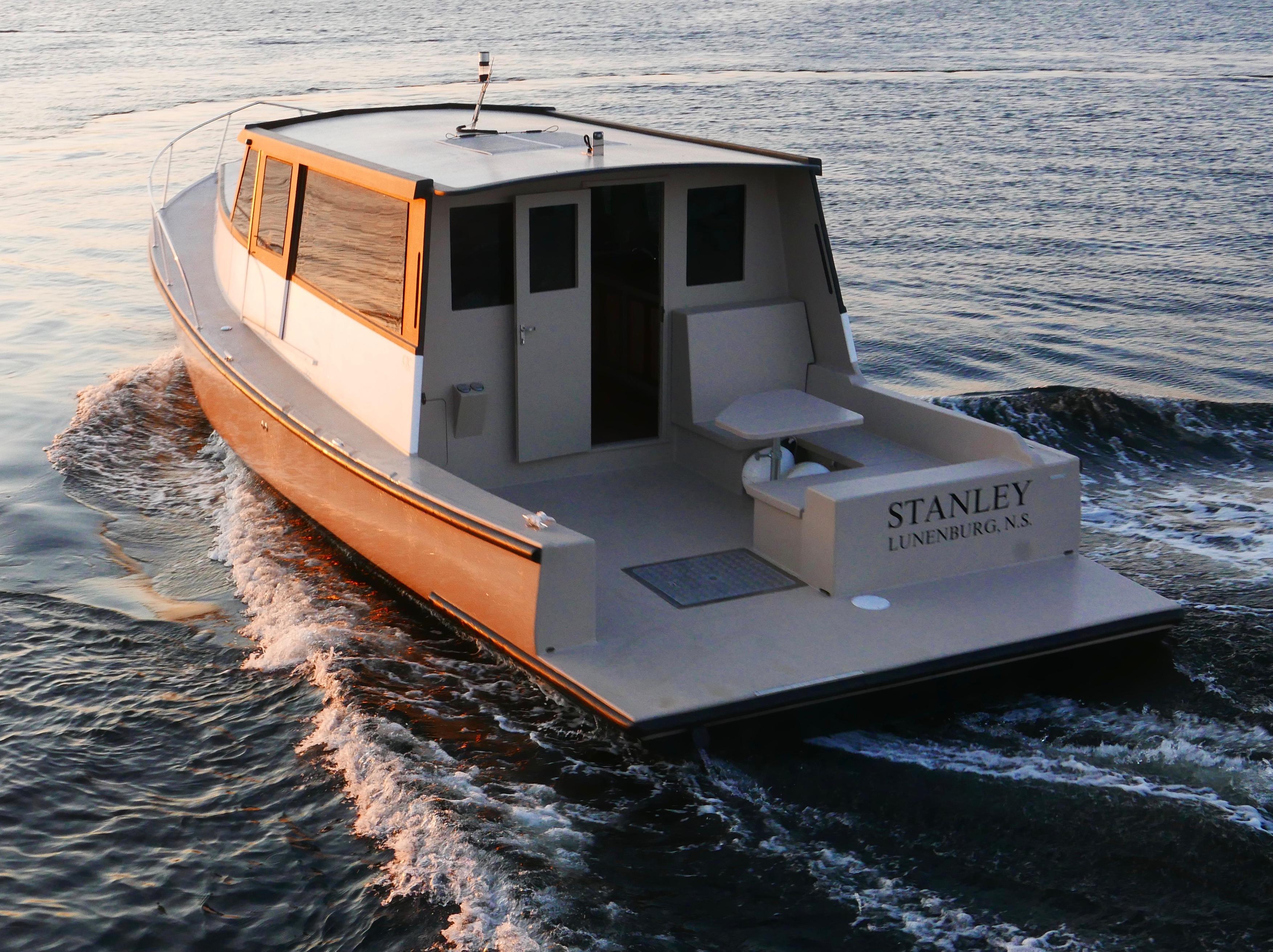 2021 Trawler Cape Island Cruisers Cape Sable navigating calm waters at sunset.
