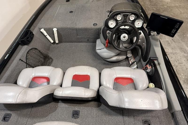 2016 Tracker Pro Team 175 TXW boat interior with steering console and seating.