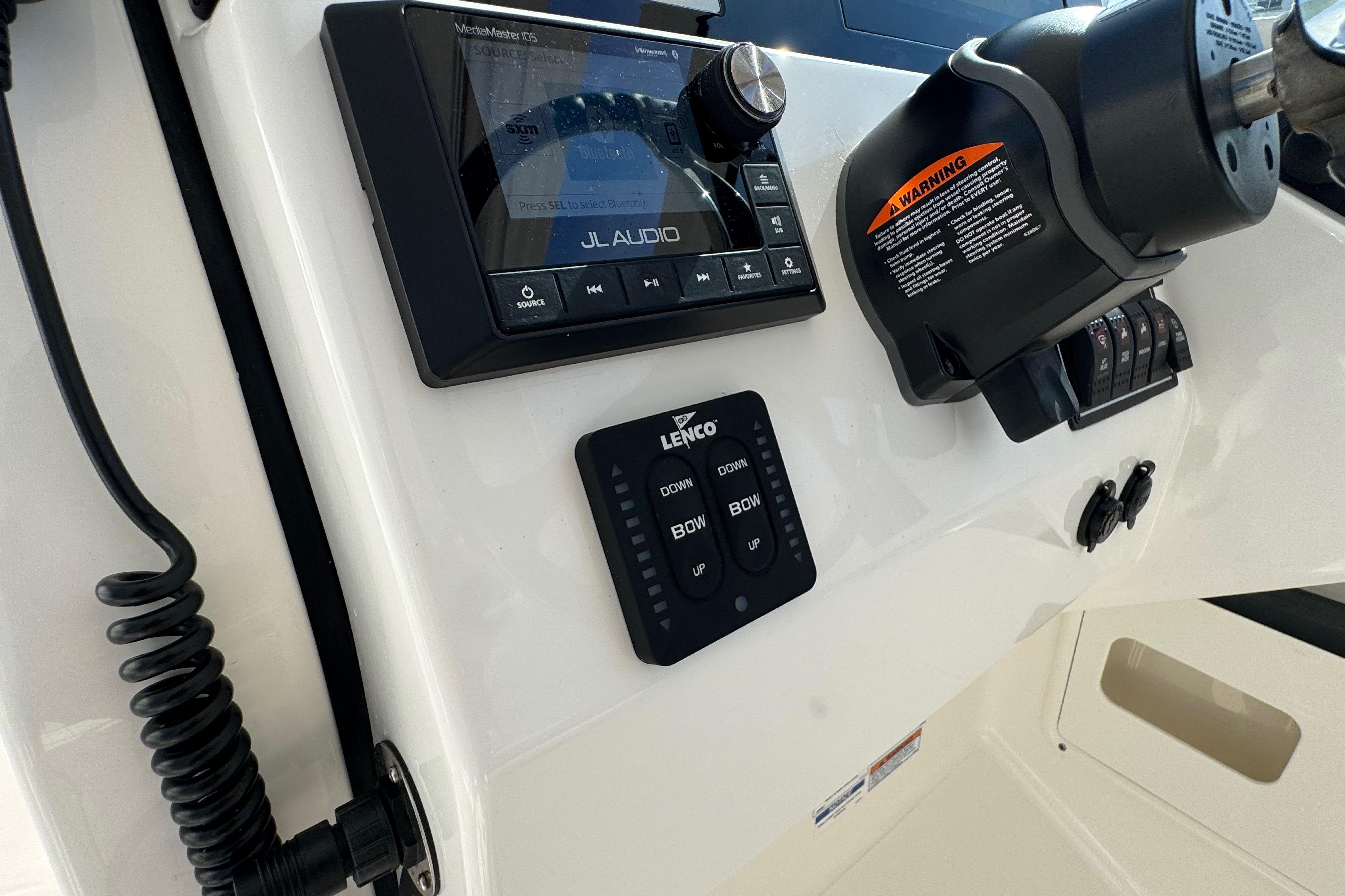 Control panel of 2022 Pursuit DC 266 Dual Console boat with JL Audio system.