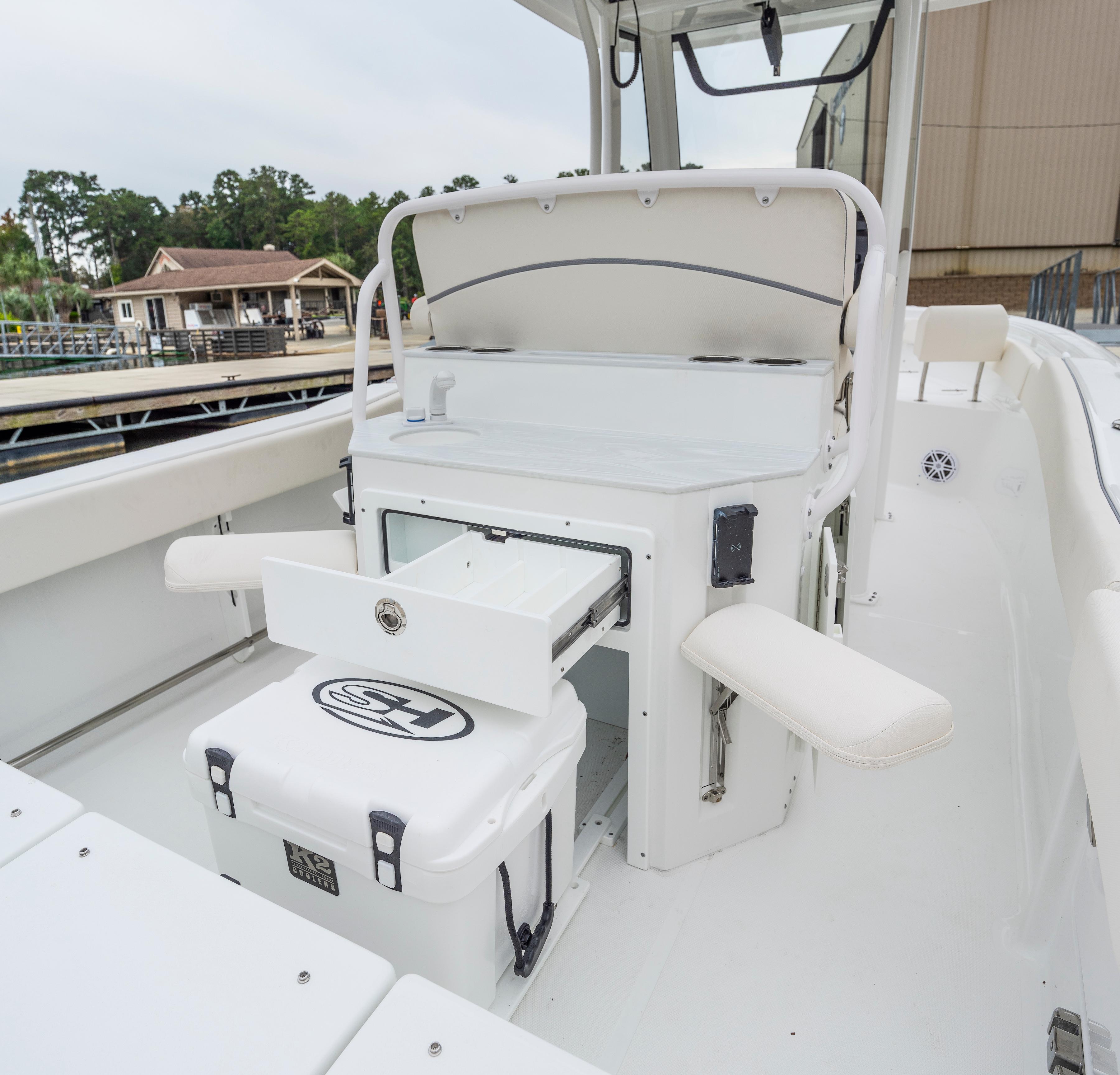 2026 Sea Hunt Ultra 245 SE boat interior with storage and seating features.