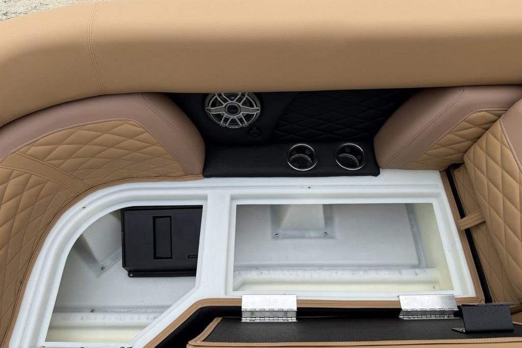Luxurious seating and storage in 2026 Godfrey Monaco 235 SFLC iMPACT boat interior.