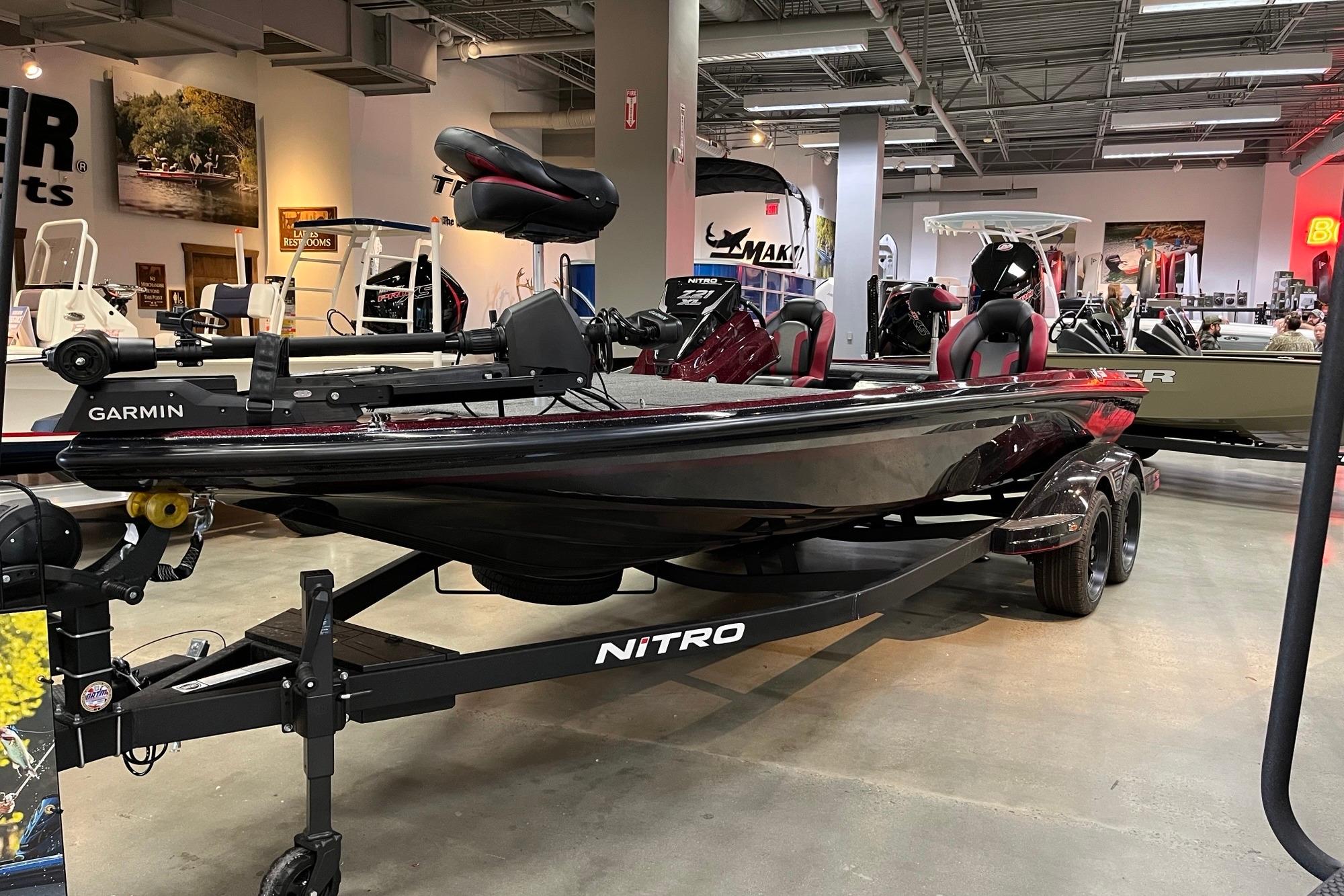 2026 Nitro Z21 XL Pro boat displayed in showroom with Garmin equipment.