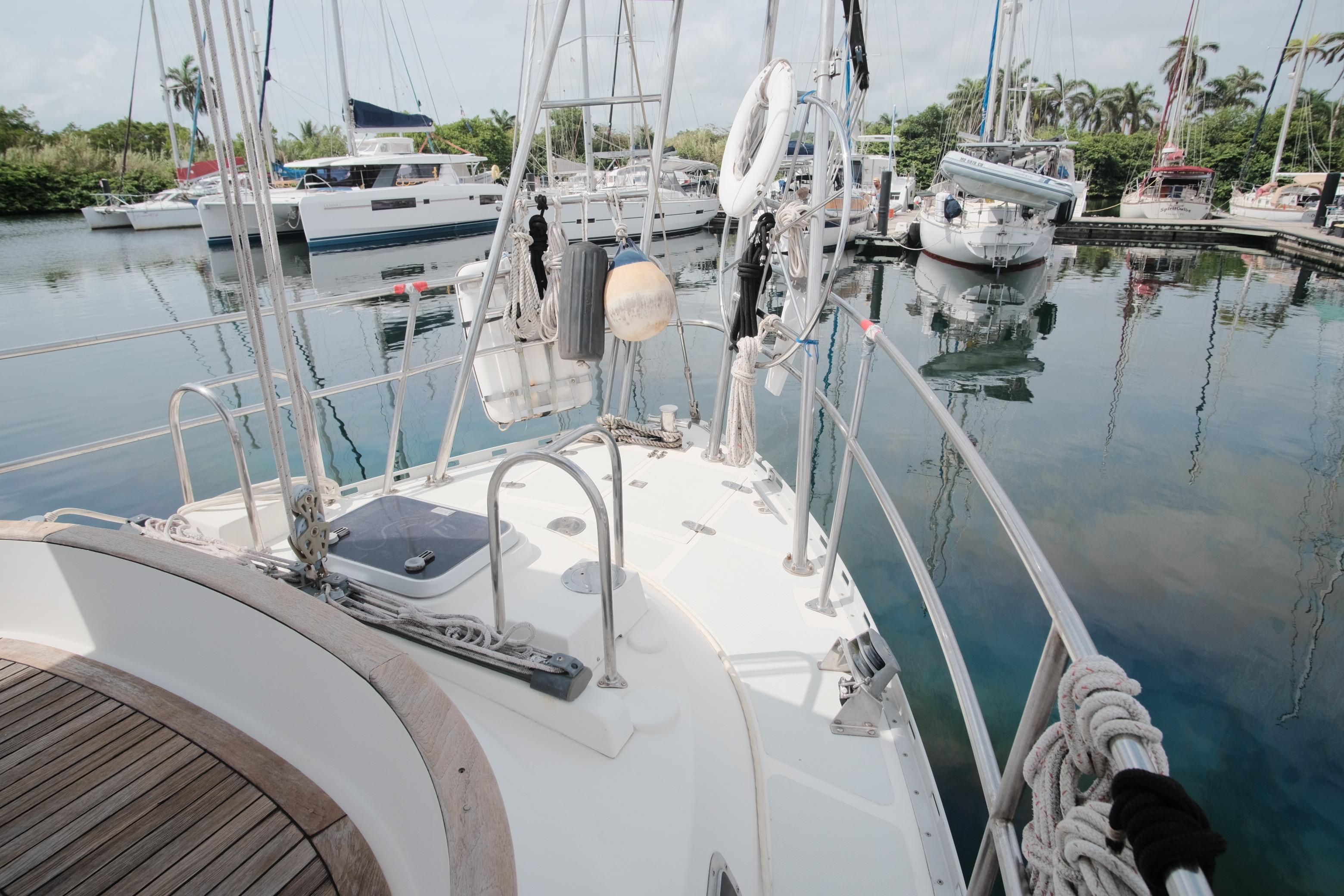 Tayana Vancouver 42 sailboat, 2006 model, docked in a marina with other boats.