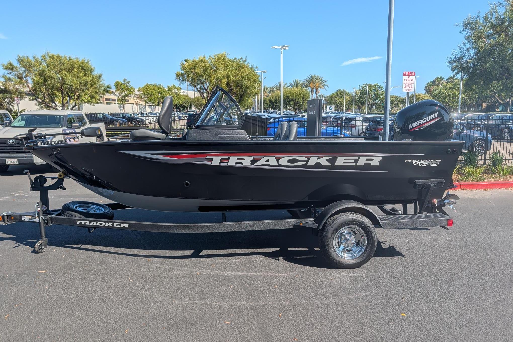 2026 Tracker Pro Guide V-175 Combo boat on trailer, parked outdoors.
