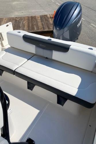 2024 Robalo R222 Center Console boat with Yamaha outboard engine and cushioned seating.