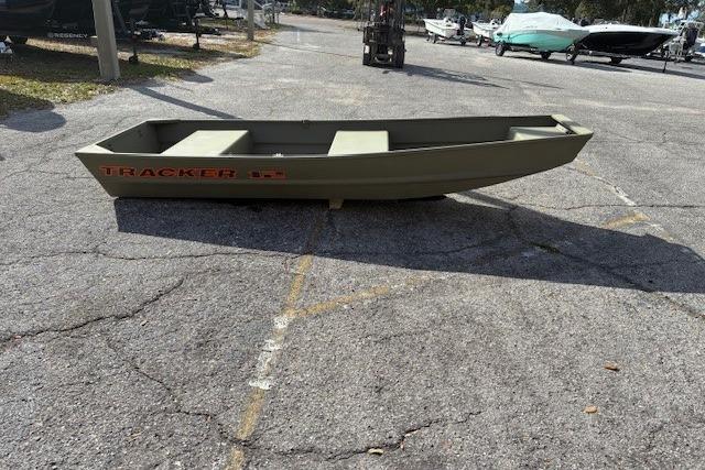 2026 Tracker Grizzly 12 Jon boat on pavement, outdoor setting.