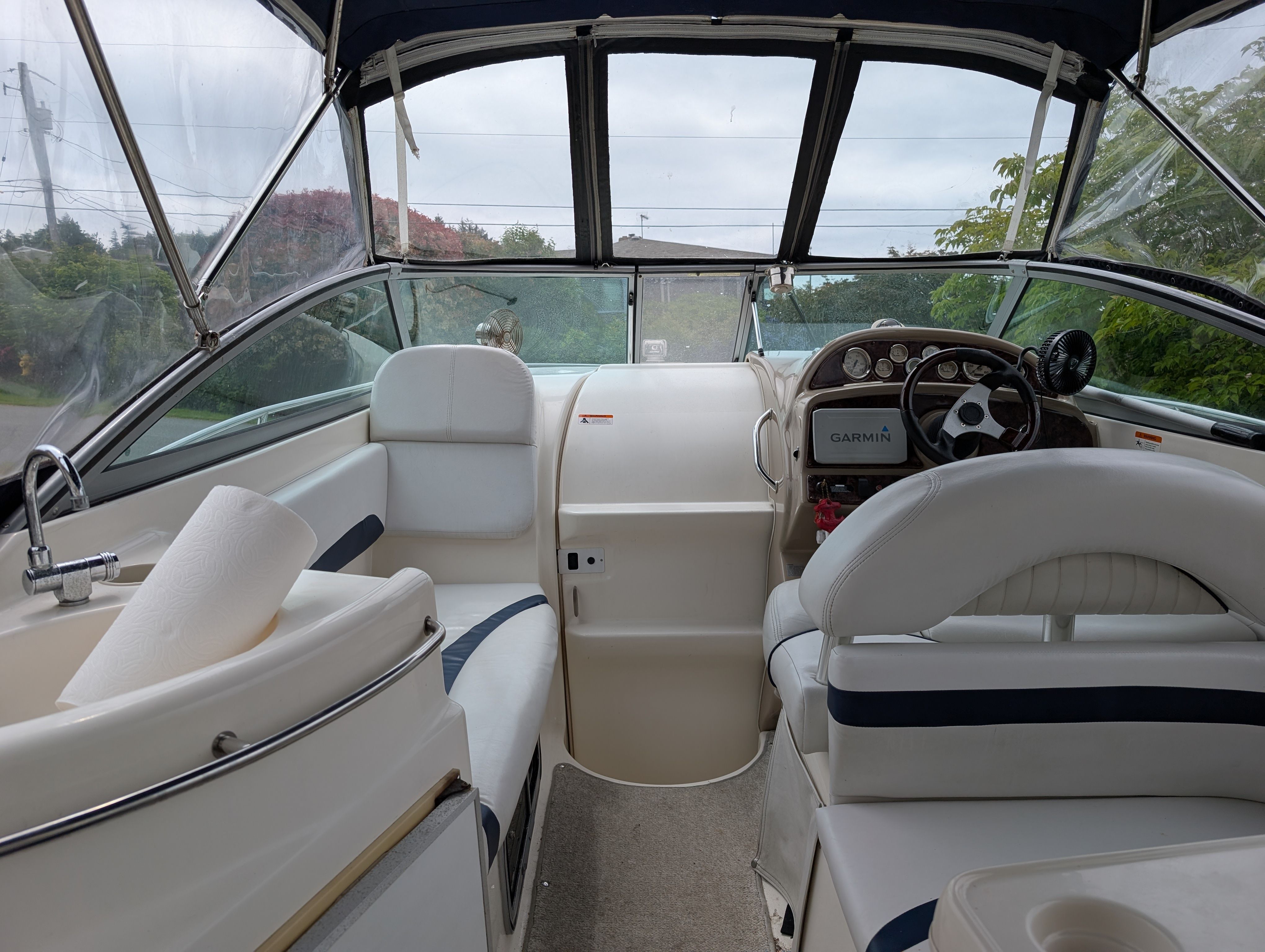 Interior of a 2006 Glastron GS boat with helm console.