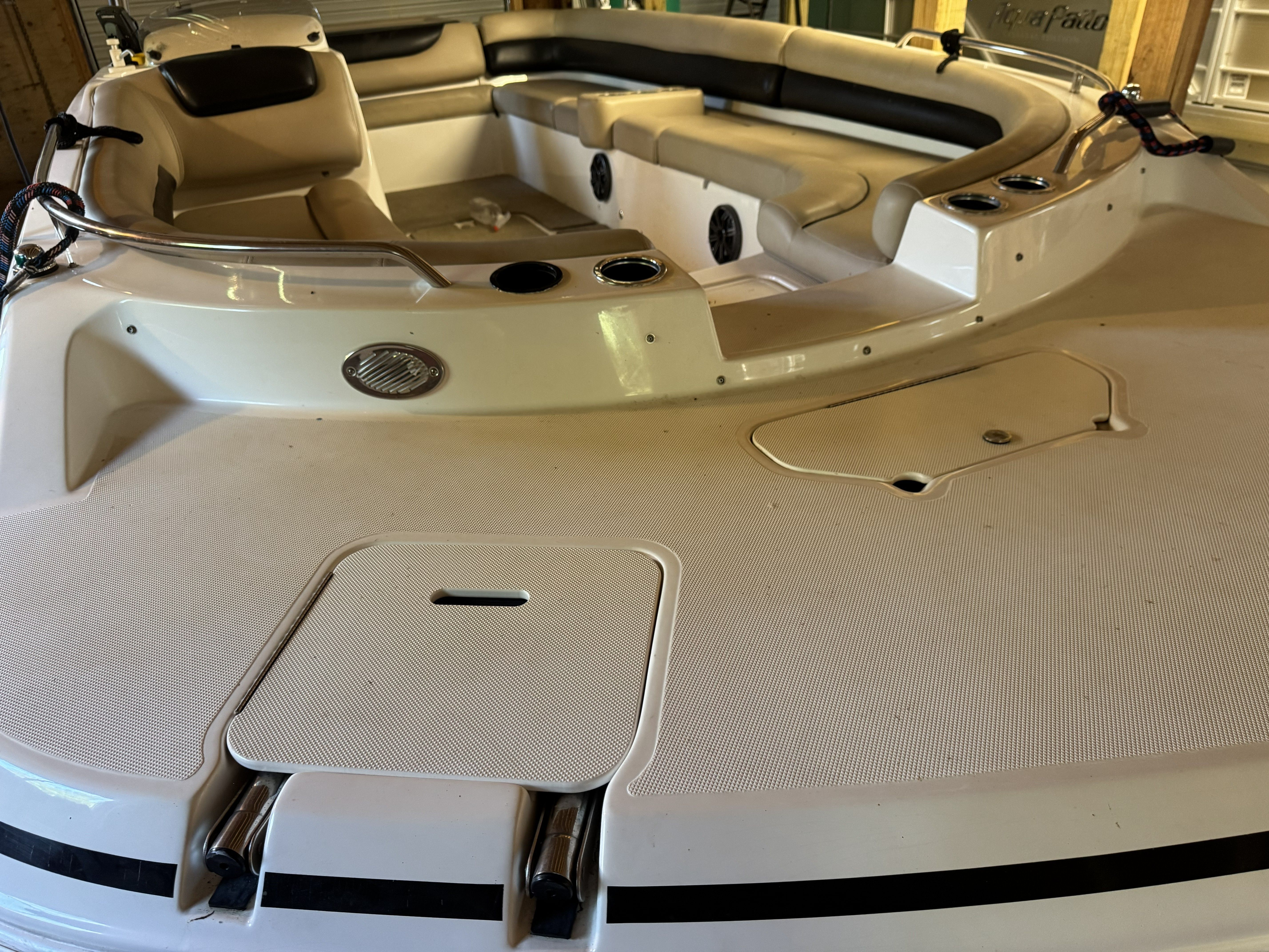 The image shows the deck of a 2014 Hurricane SS201 I/O boat with seating areas.