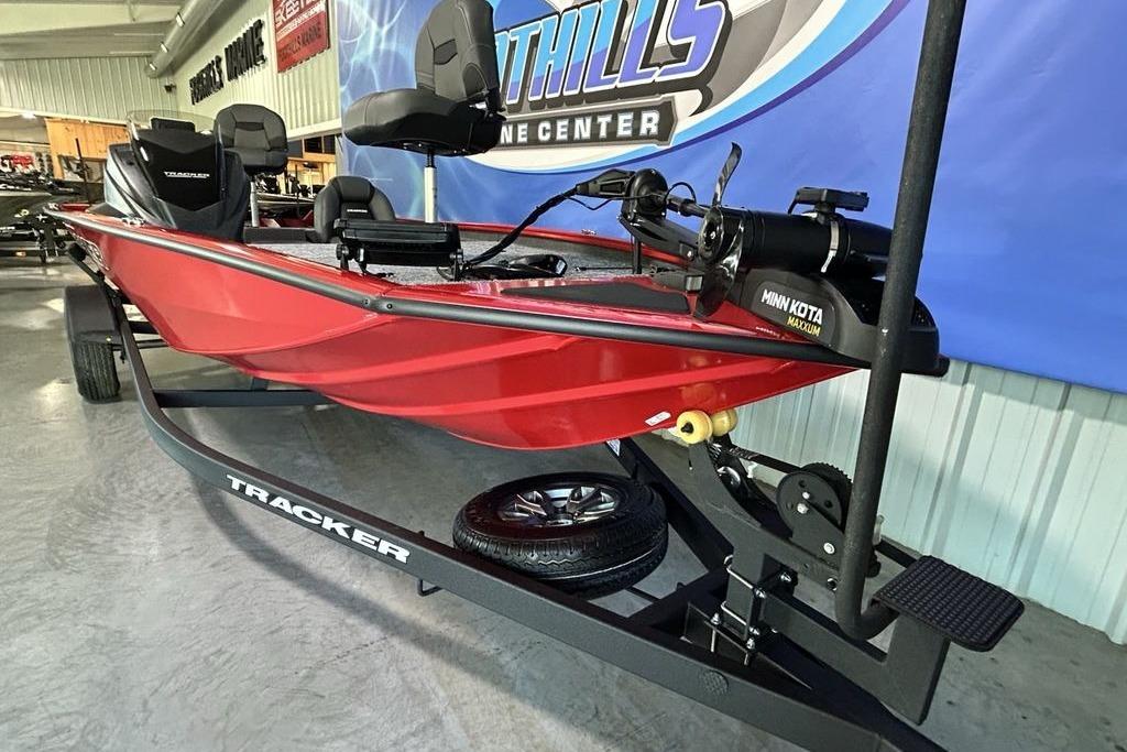 2026 Tracker Pro Team 195 boat on trailer in showroom setting.