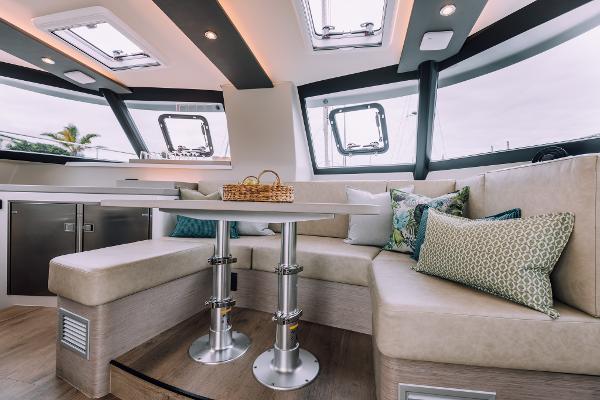 Luxurious interior of Vision 444 yacht, 2026 model, featuring elegant seating and modern design.