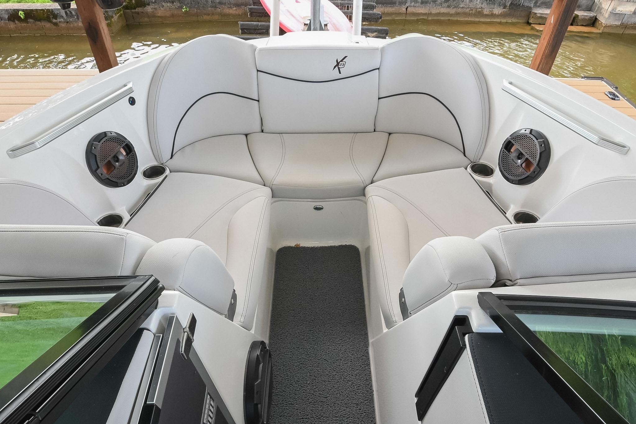 2018 MasterCraft X23 boat interior with plush seating and built-in speakers.