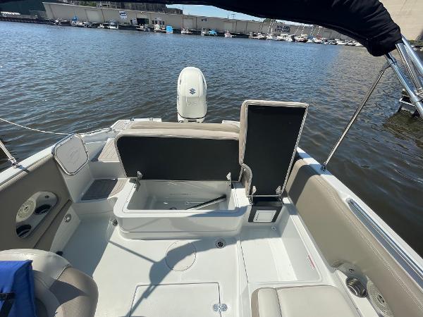 2020 Crownline E 205 XS boat interior with open storage, docked by the water.