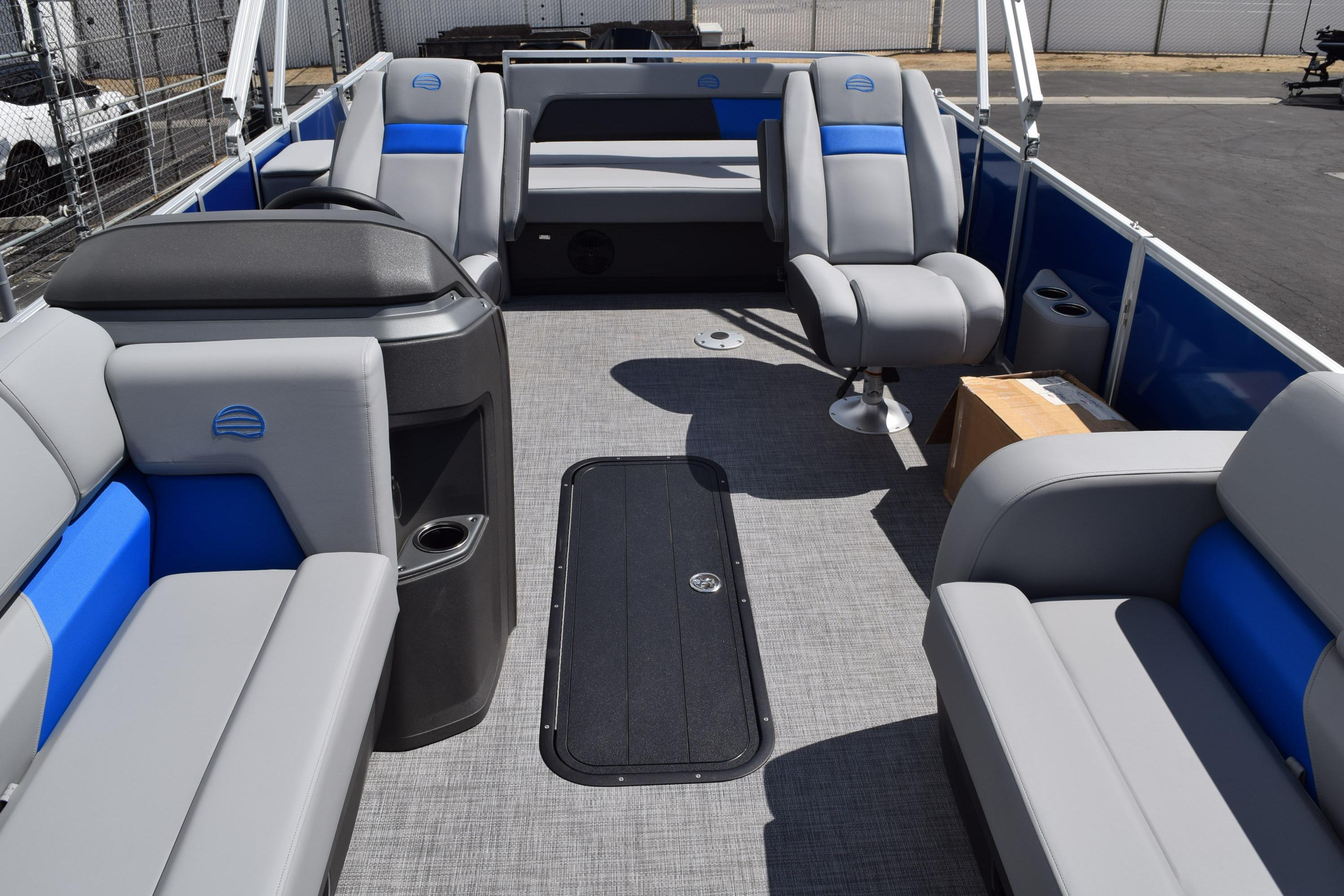 2026 Sun Tracker Party Barge 22 RF XP3 interior with gray and blue seating.
