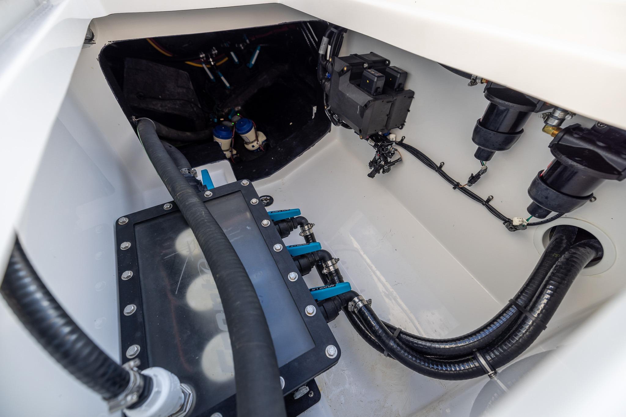 Engine compartment of 2026 Front Runner 37 Catamaran, showcasing hoses and components.