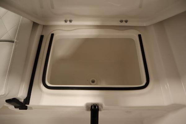 2025 Sea Fox 228 Traveler storage compartment, open and empty.