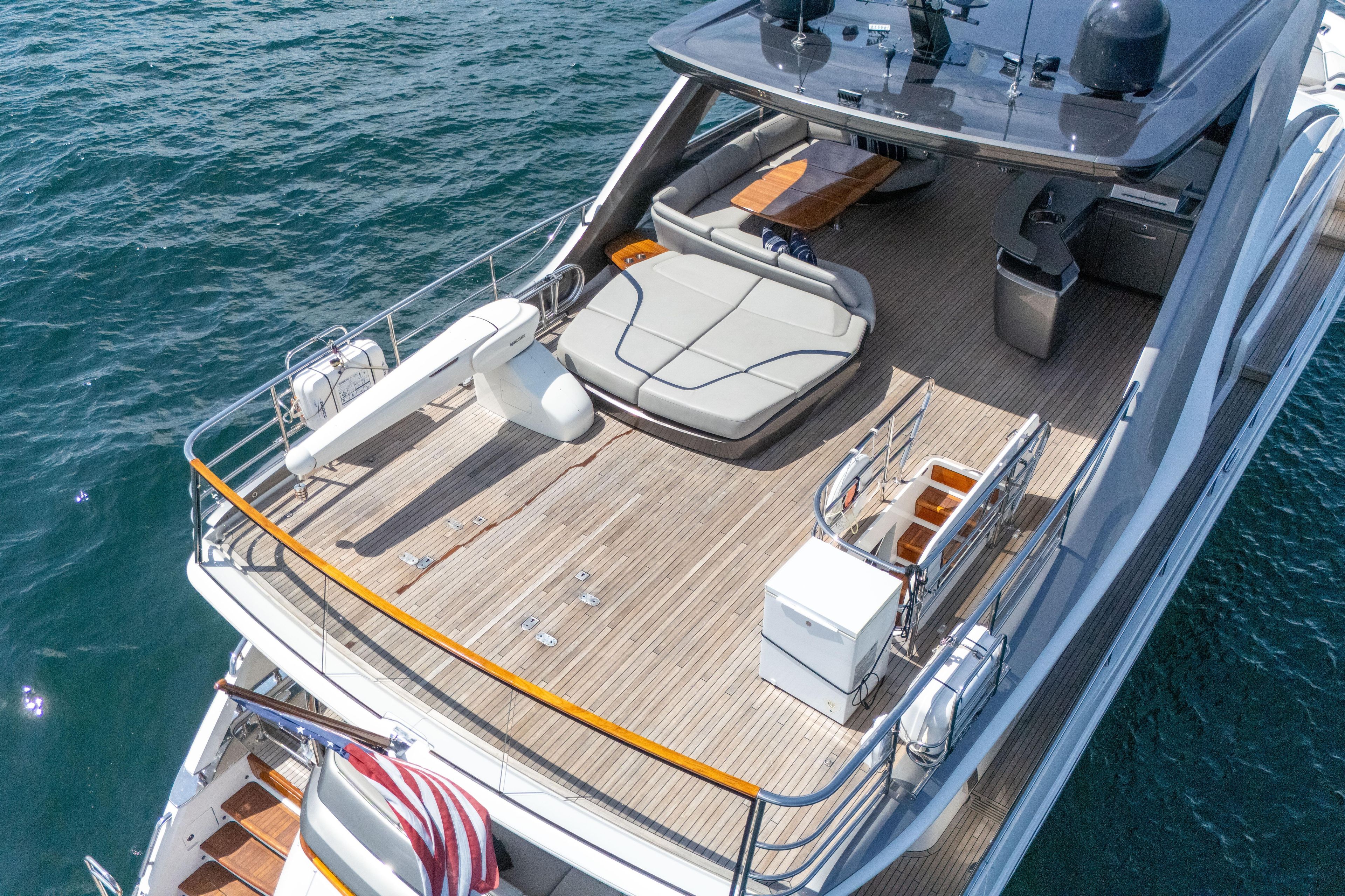 Luxurious 2020 Princess Y85 yacht deck with seating and ocean view.