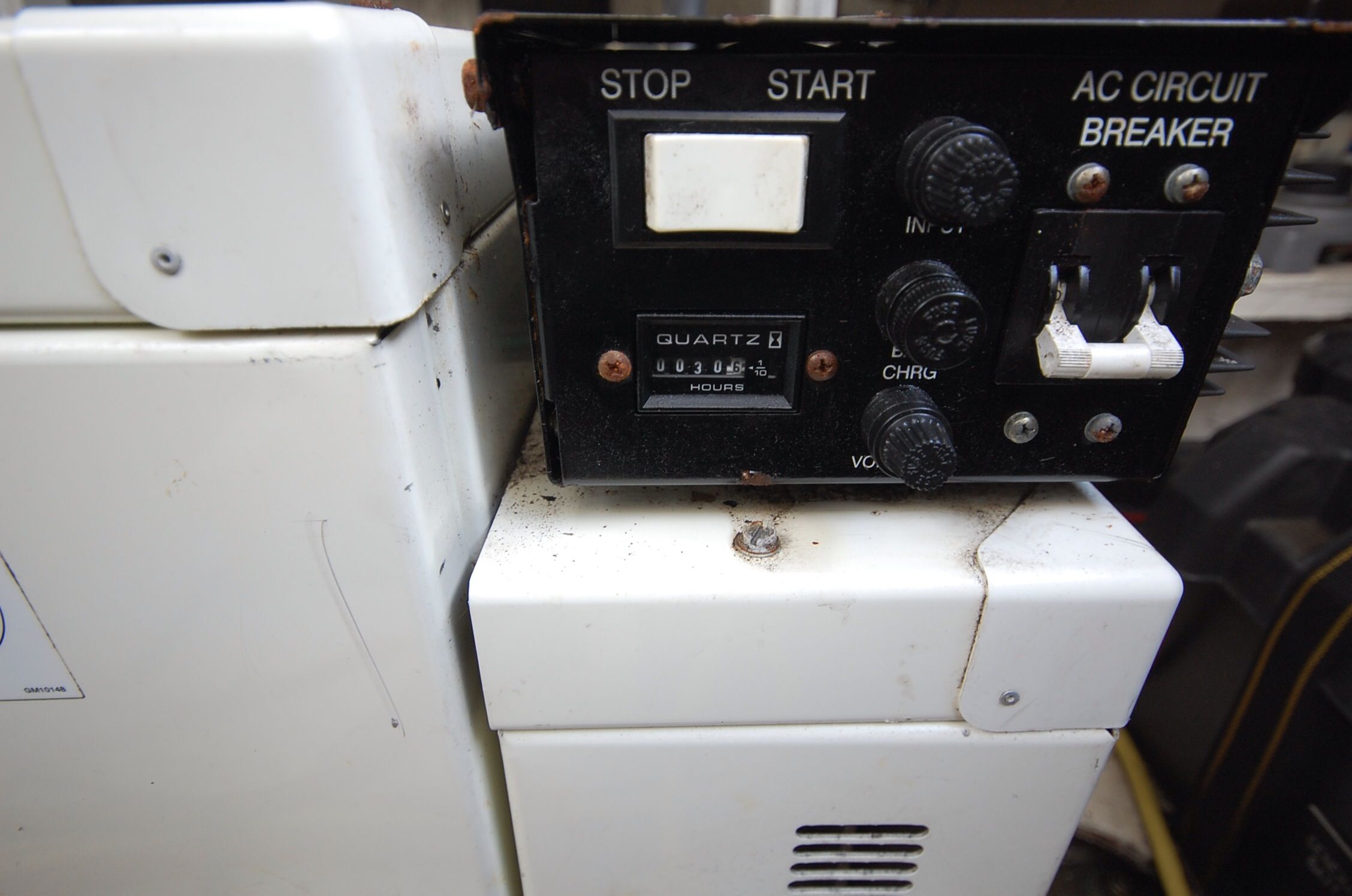 Control panel of a 2004 Cruisers Yachts 3970 with hour meter.