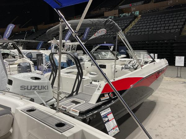 2024 Starcraft SVX 190 OB DC boat with Suzuki outboard motor on display.