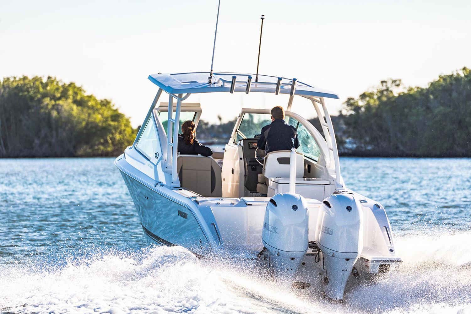 Manufacturer Provided Image: 2025 Pursuit DC 266 Dual Console boat cruising on a sunny day.
