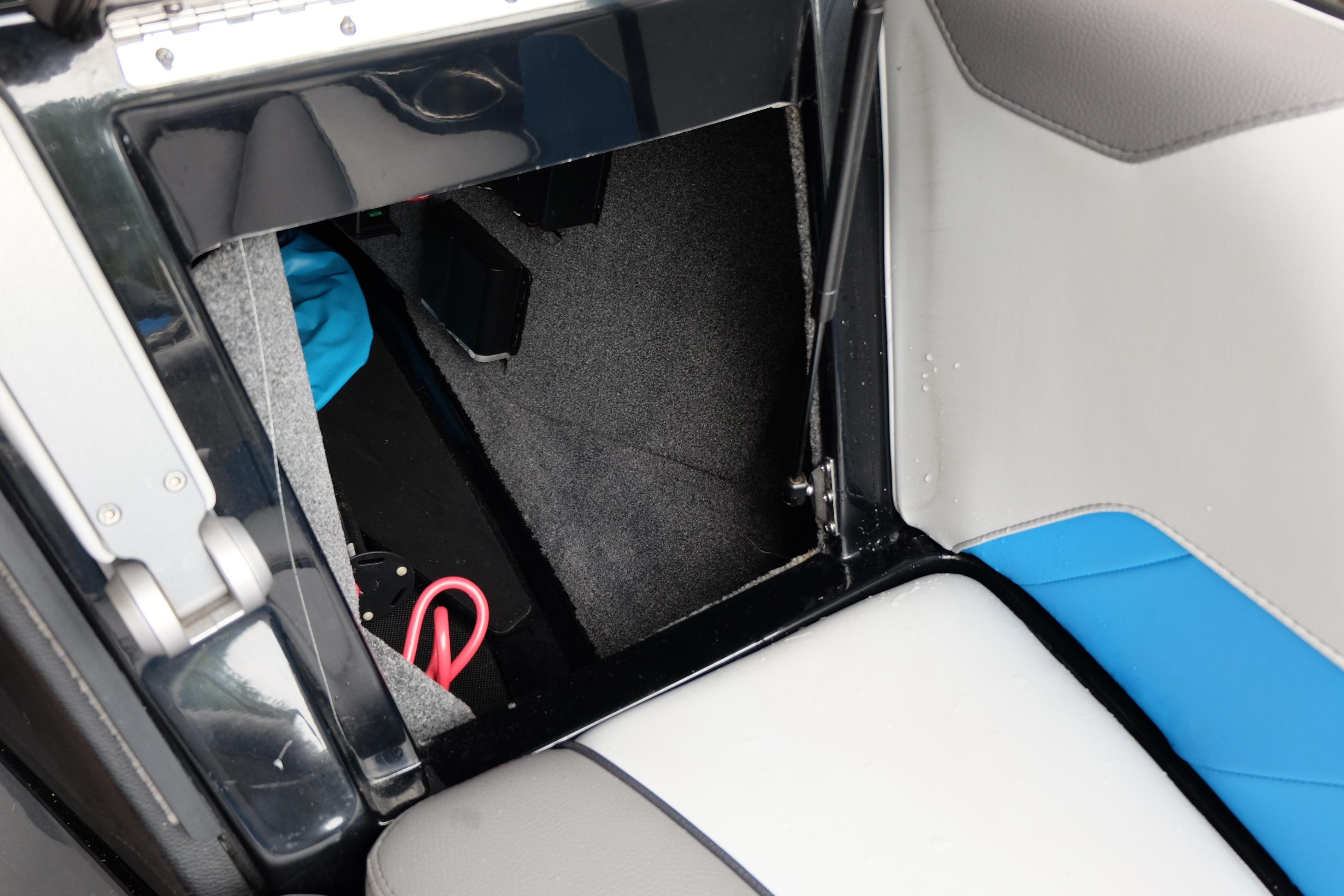 2020 Malibu Wakesetter 23 LSV interior storage compartment with blue and gray upholstery.