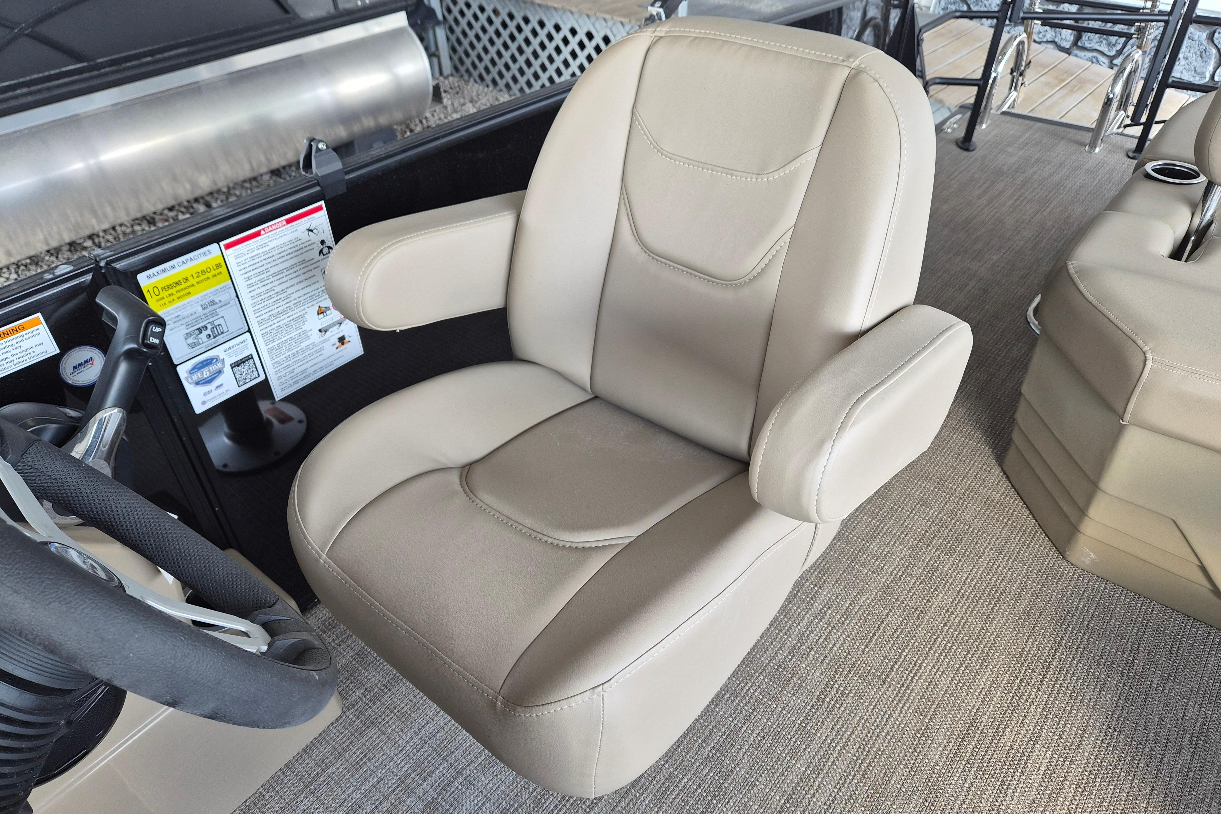 Captain's chair in 2026 Sylvan Mirage 820 CLZ DH boat, featuring beige upholstery.