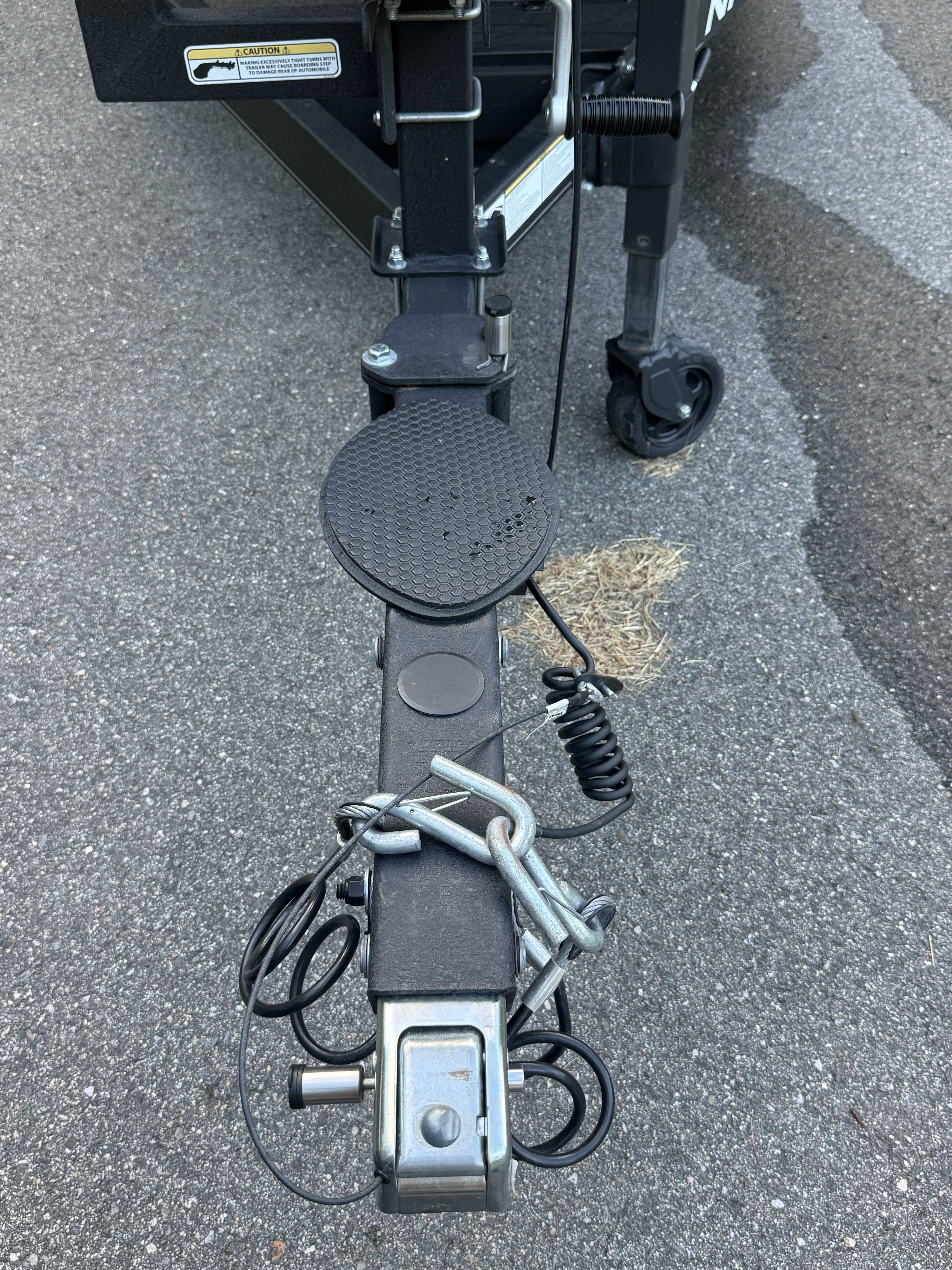 Close-up of a Nitro Z21 XL Pro boat trailer hitch from 2023 on asphalt.