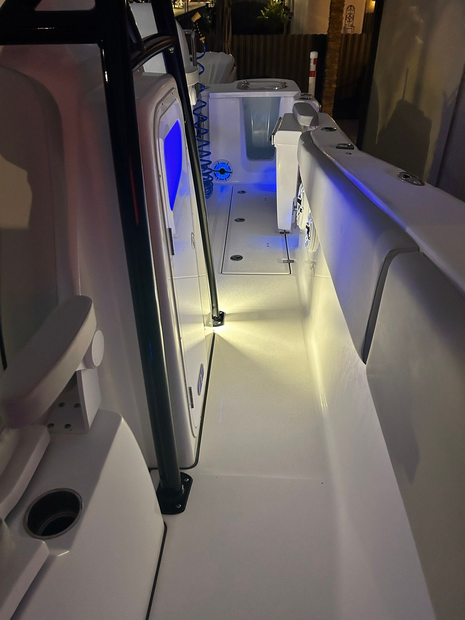 The image shows the illuminated deck of a Sea Fox 288 Commander boat at night.