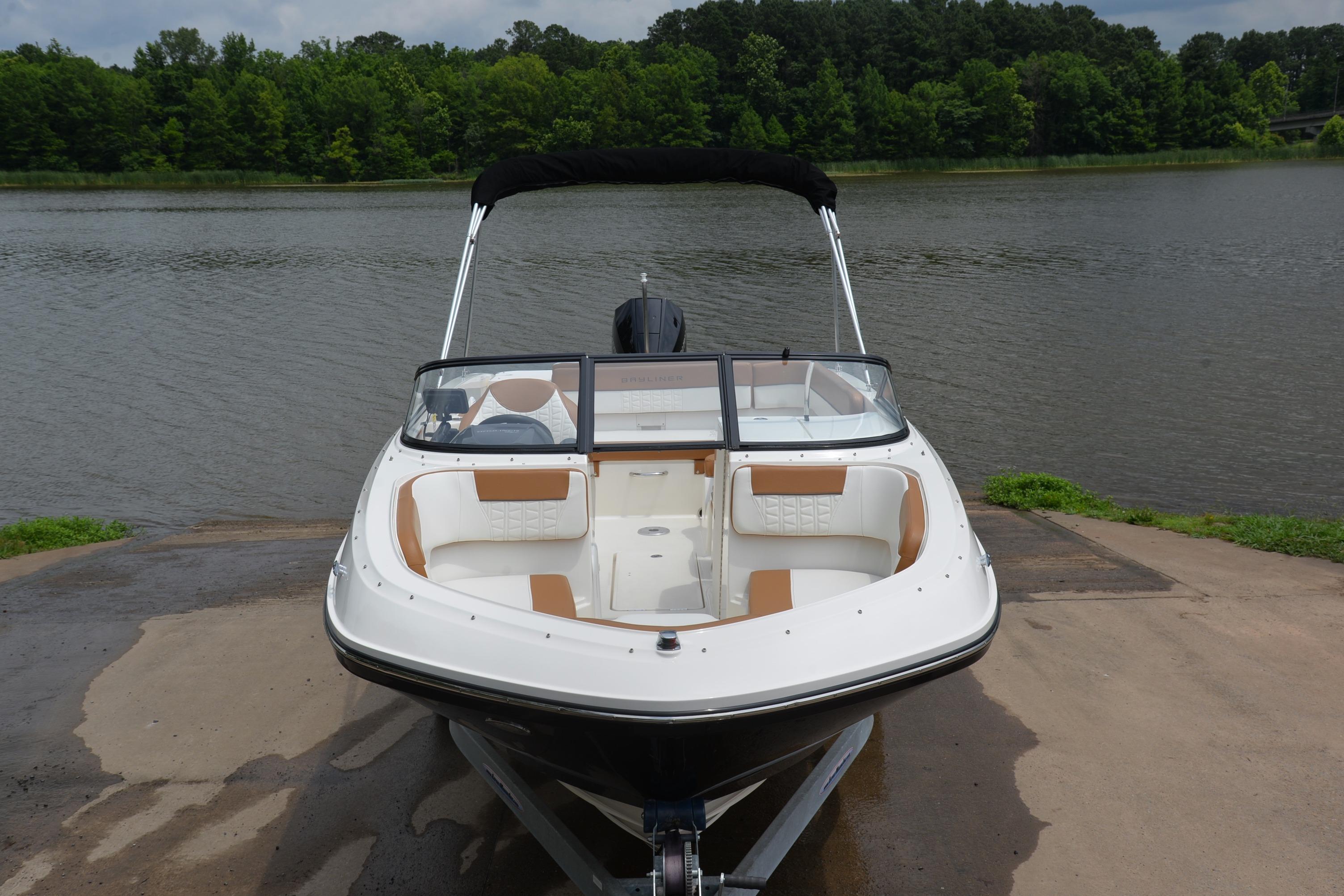 2019 Bayliner VR6 Bowrider OB on a boat ramp by a lake.