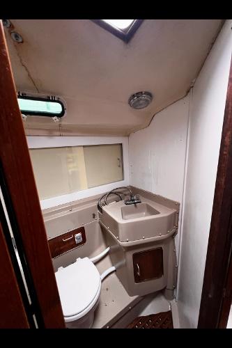 1983 O'Day 39 yacht bathroom with compact sink and toilet.