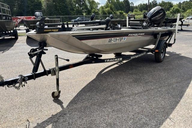 2015 Tracker Panfish 16 boat on trailer, parked outdoors, featuring Mercury outboard motor.