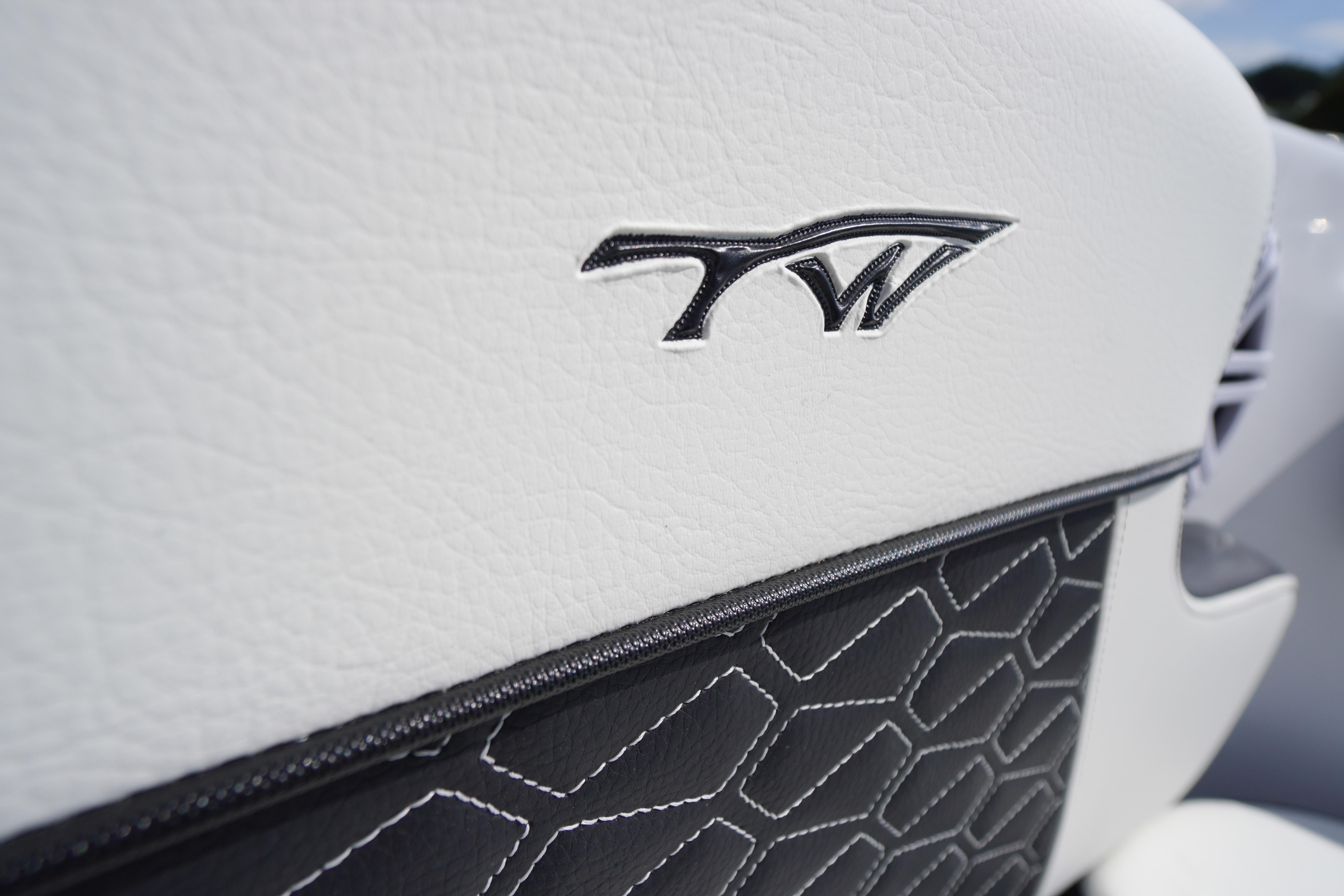 Close-up of 2026 Tidewater 220 CC Adventure boat seat with logo and textured design.