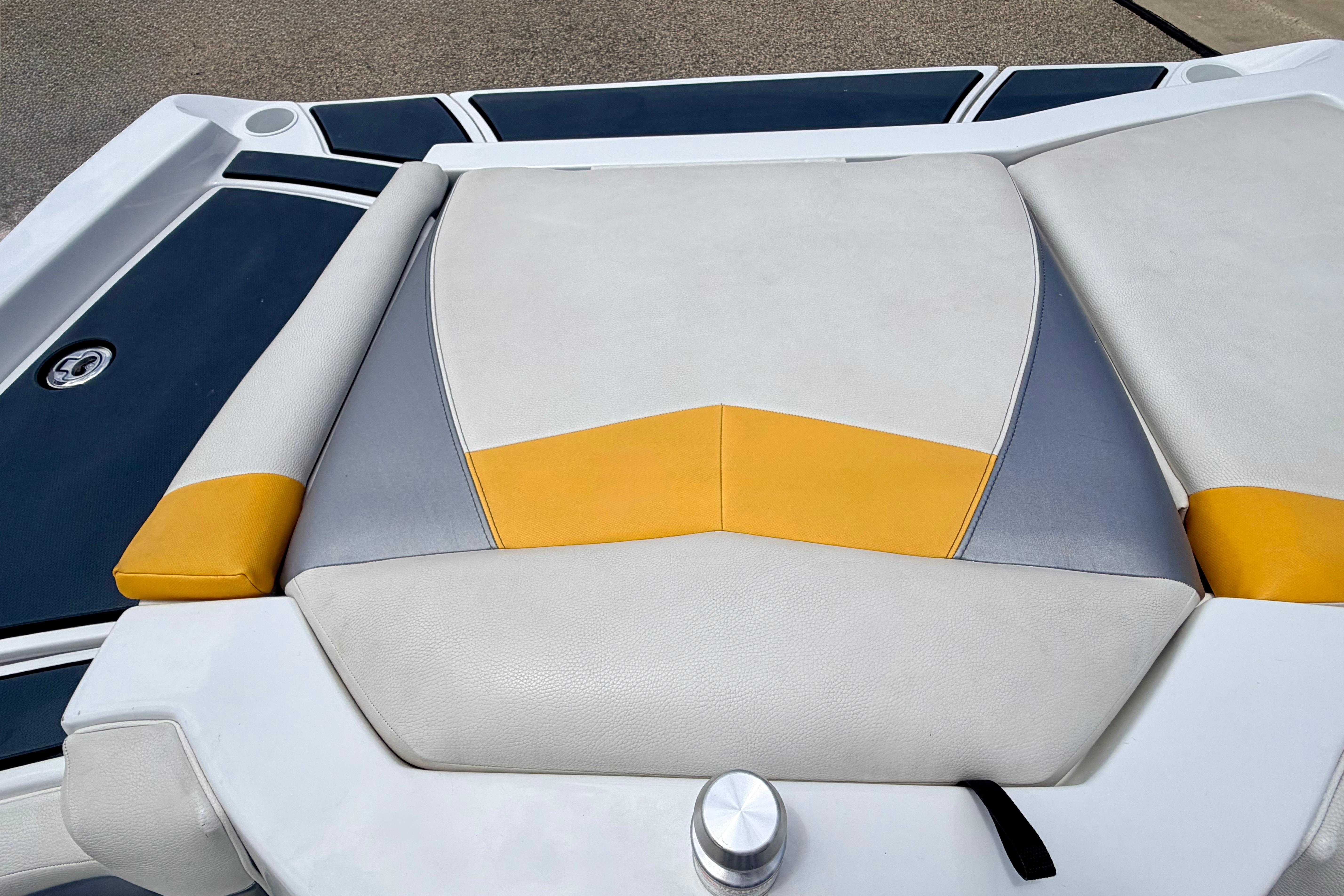 2014 Tigé R20 boat seat with yellow and gray accents, showcasing modern design.
