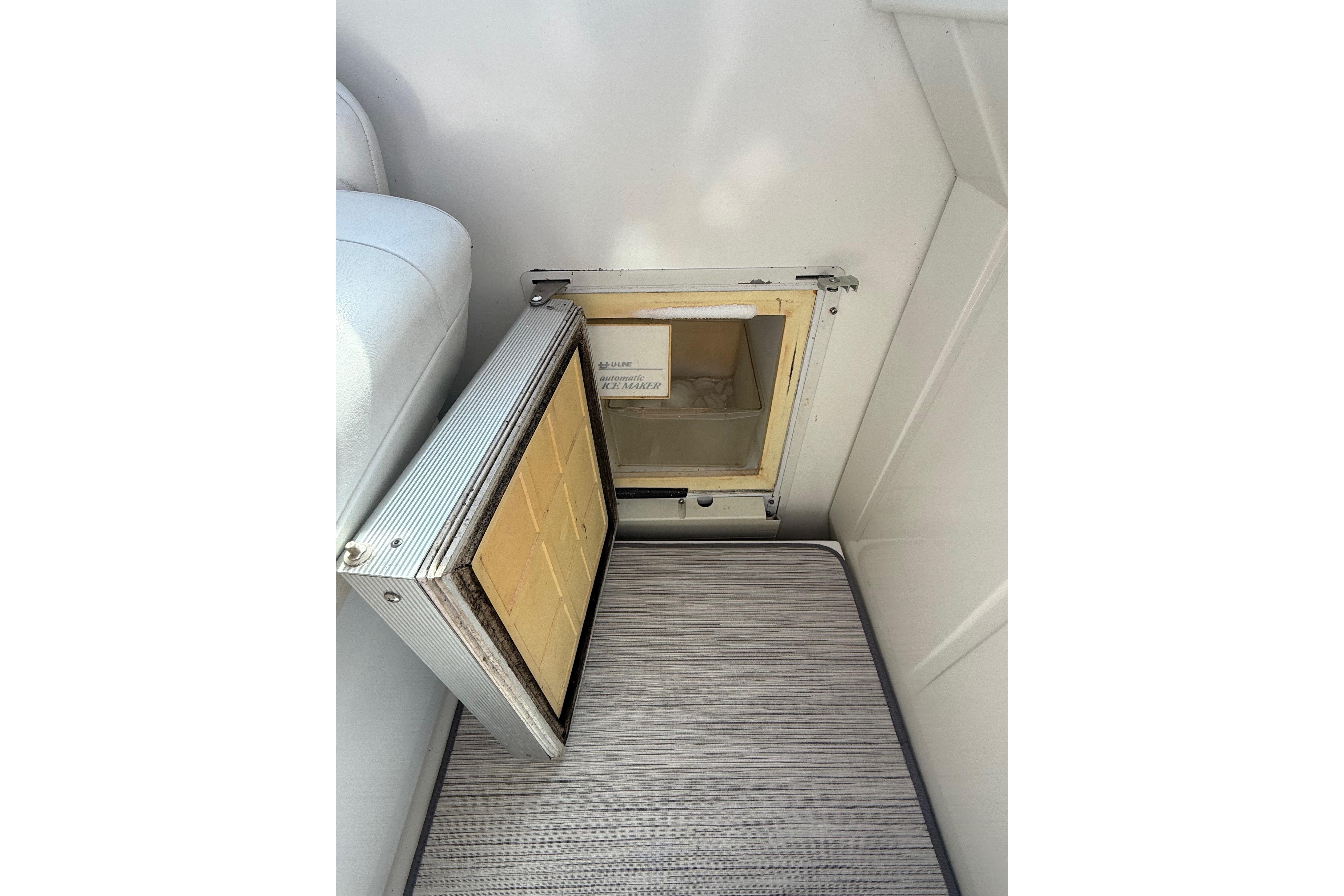 Open hatch on 1999 Formula 34 Performance Cruiser, revealing interior compartment.