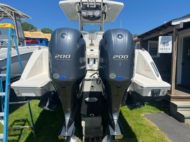 Two Yamaha 200 outboard engines are mounted on the stern of a Pursuit S268 boat.