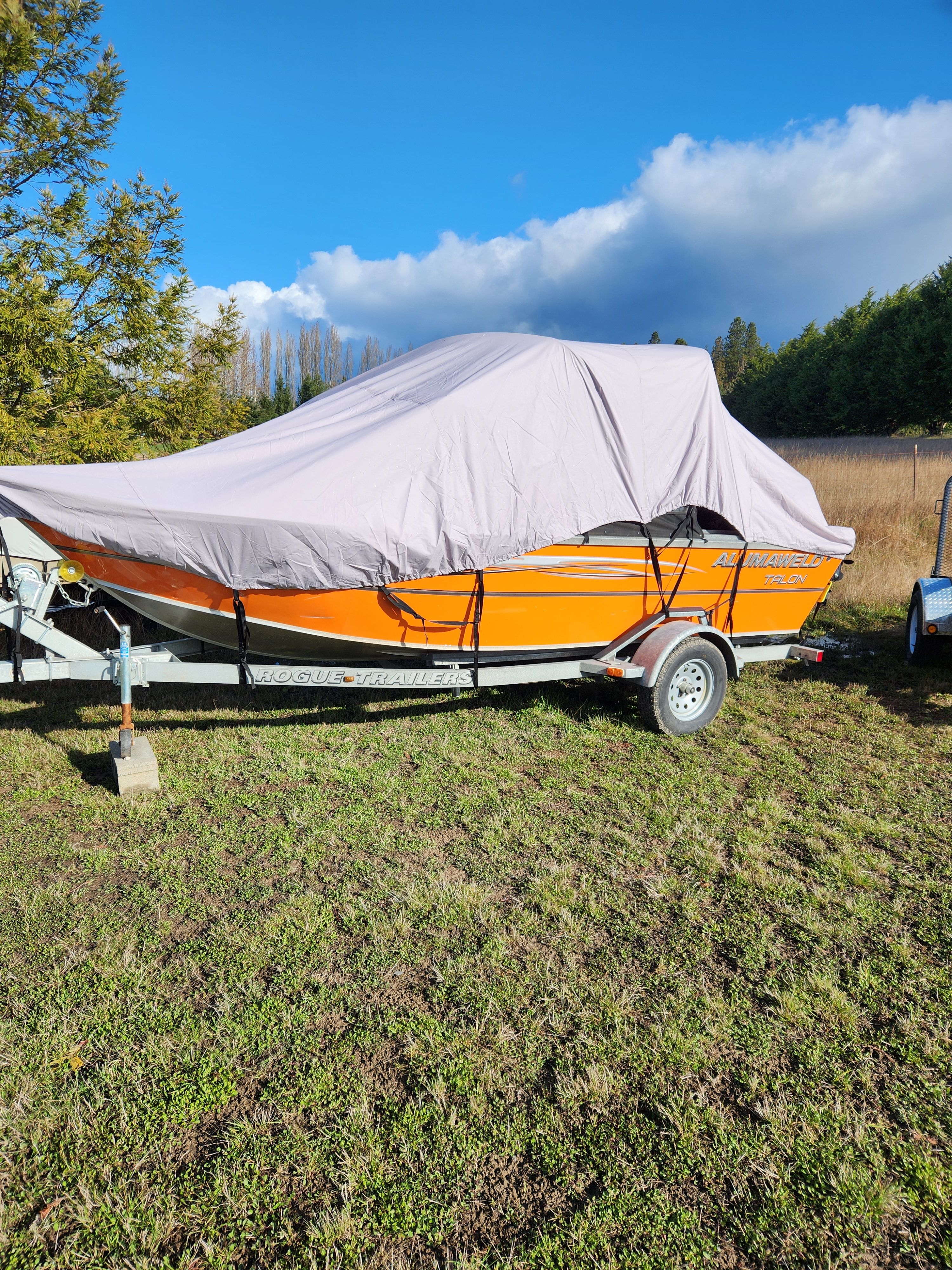 2020 Alumaweld Talon 18 boat covered on trailer.