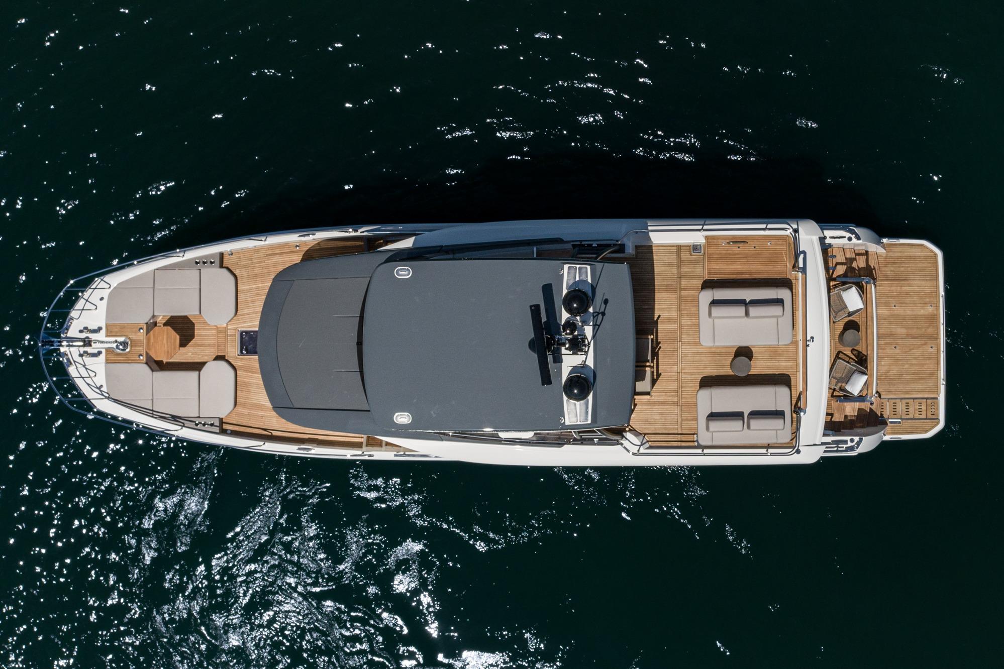 Top view of 2024 Prestige X60 yacht on water, showcasing luxurious deck layout.