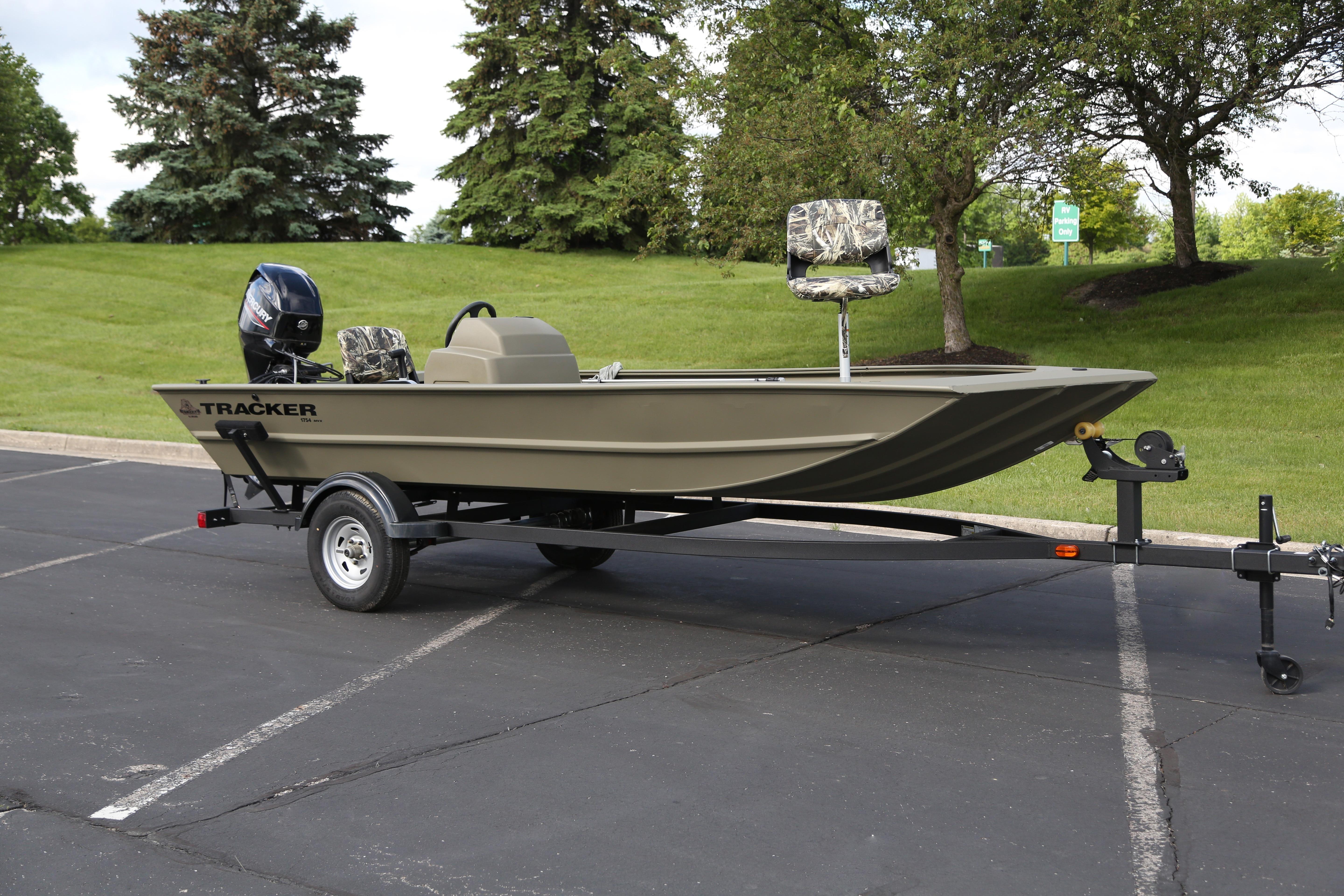 2026 Tracker Grizzly 1754 SC boat on trailer in parking lot.