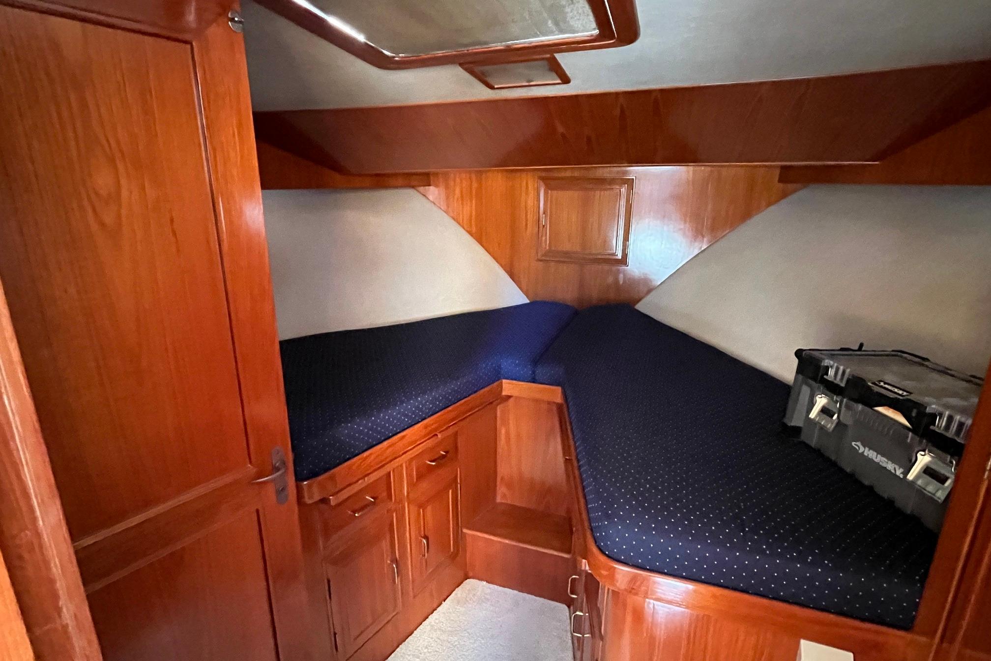 1989 Ocean Alexander 440 Sundeck CPMY cabin with wooden interior and twin beds.