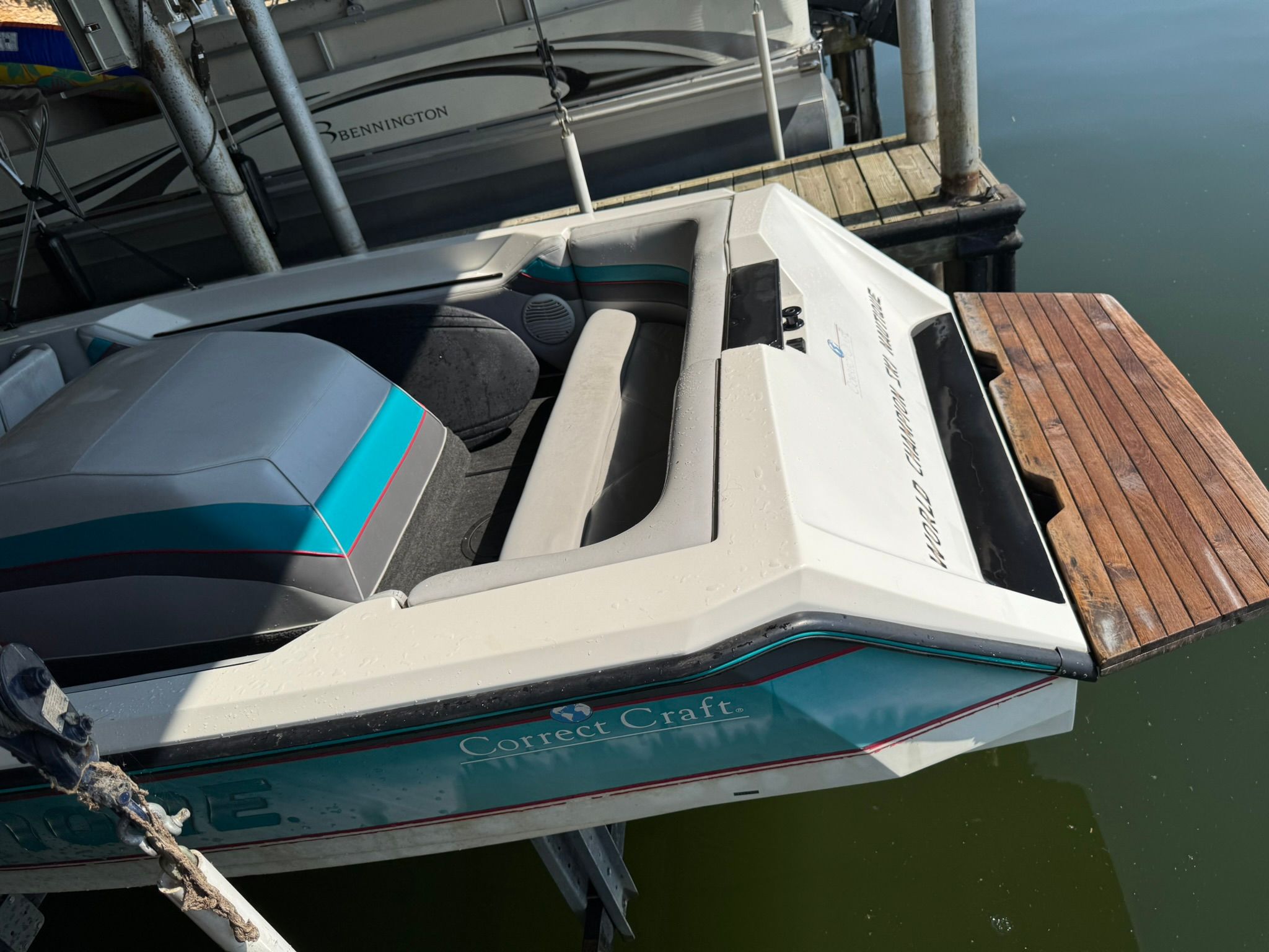 1991 Correct Craft Ski Nautique boat at dock.