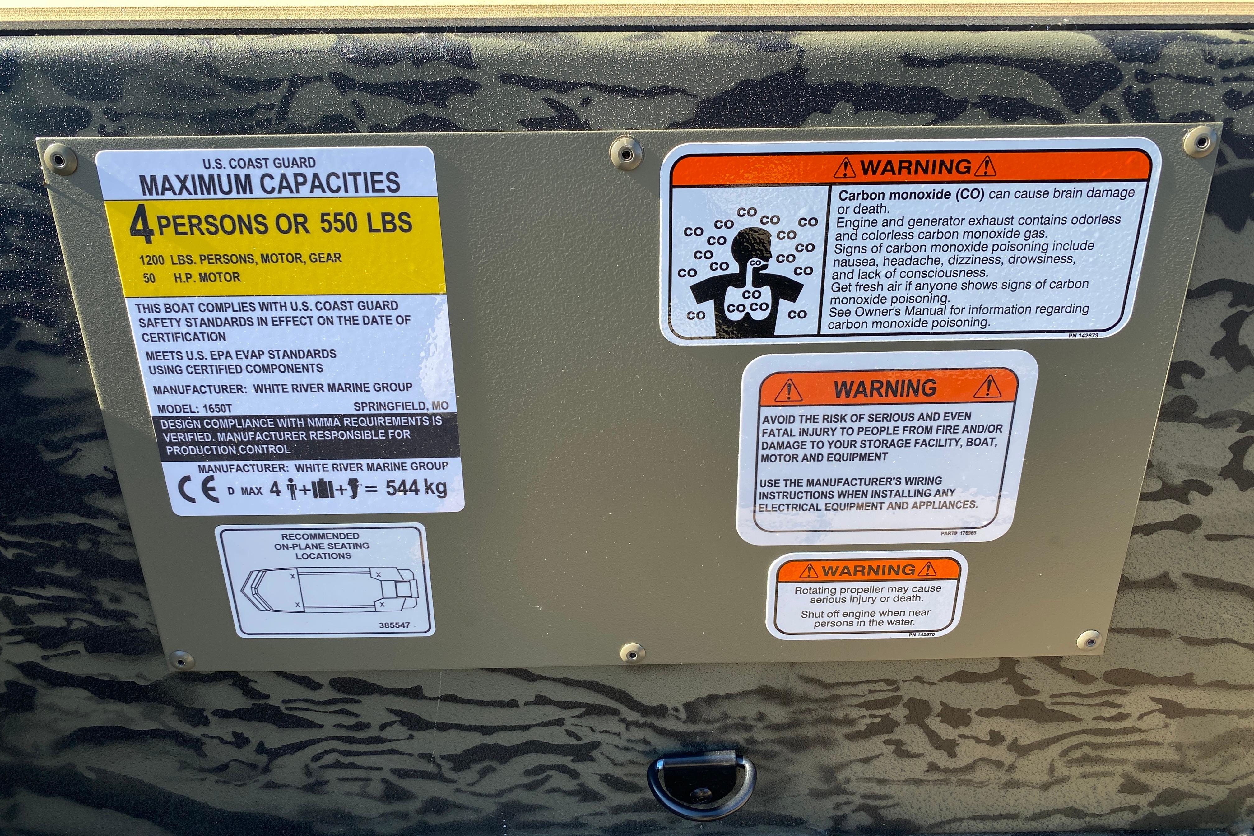 2026 Tracker Grizzly 1650 T Prairie Wings Edition safety and capacity warning labels.