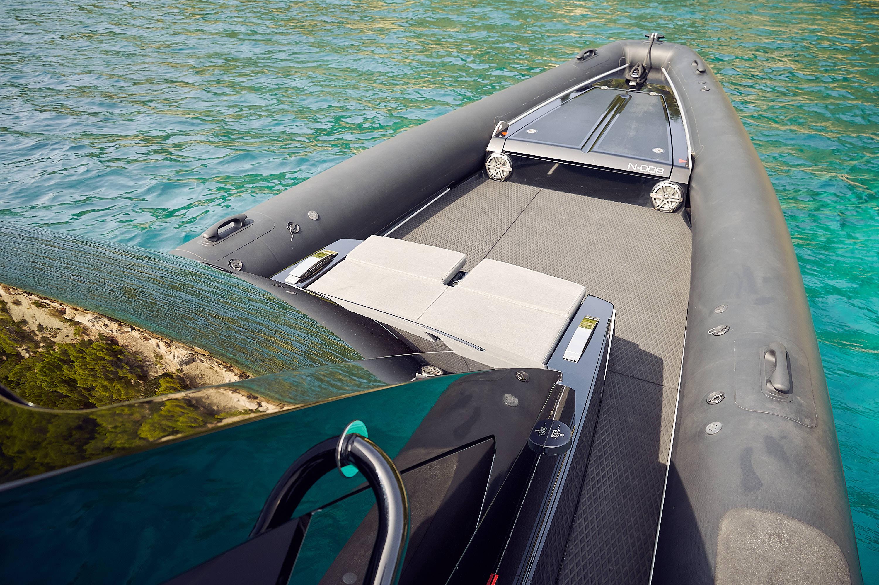 2016 Goldfish 38 Supersport boat on clear turquoise water, showcasing sleek design and seating.