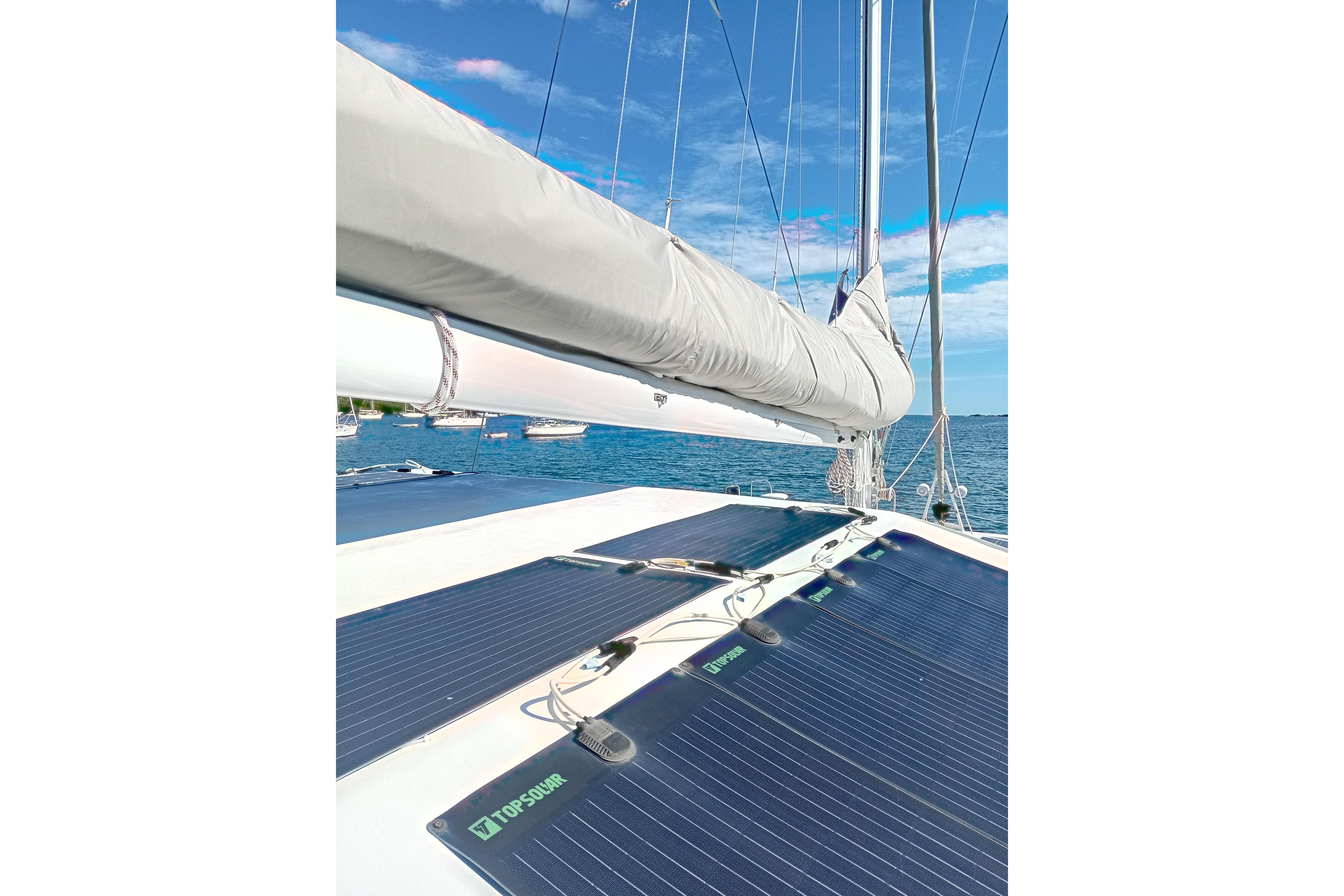 Sailing catamaran Fountaine Pajot Marquises 56 with solar panels, 1995 model, on a sunny day.