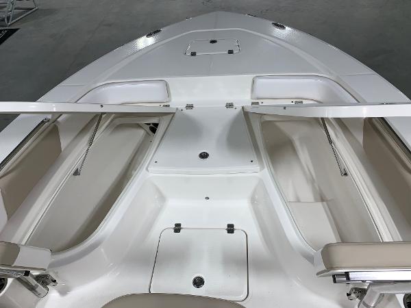 2026 Robalo 226 Cayman boat interior with open storage compartments and seating.